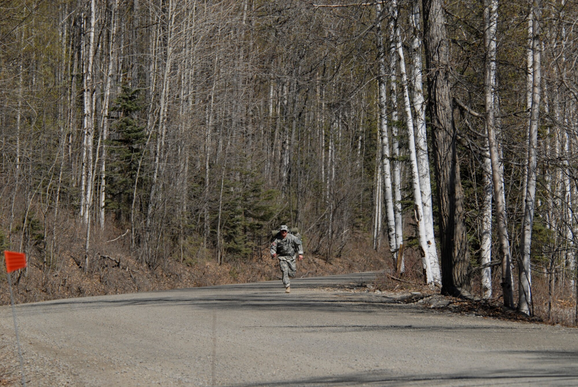 SFC Joshua Lothspeich, Company B, 3-509, competed in the Combat-Cross Country Run. Running around Otter Lake carring 35 pound ruck sacks he was first across fininsh line  in 27 minutes 5 seconds. (U.S. Air Force photo/Steven White)