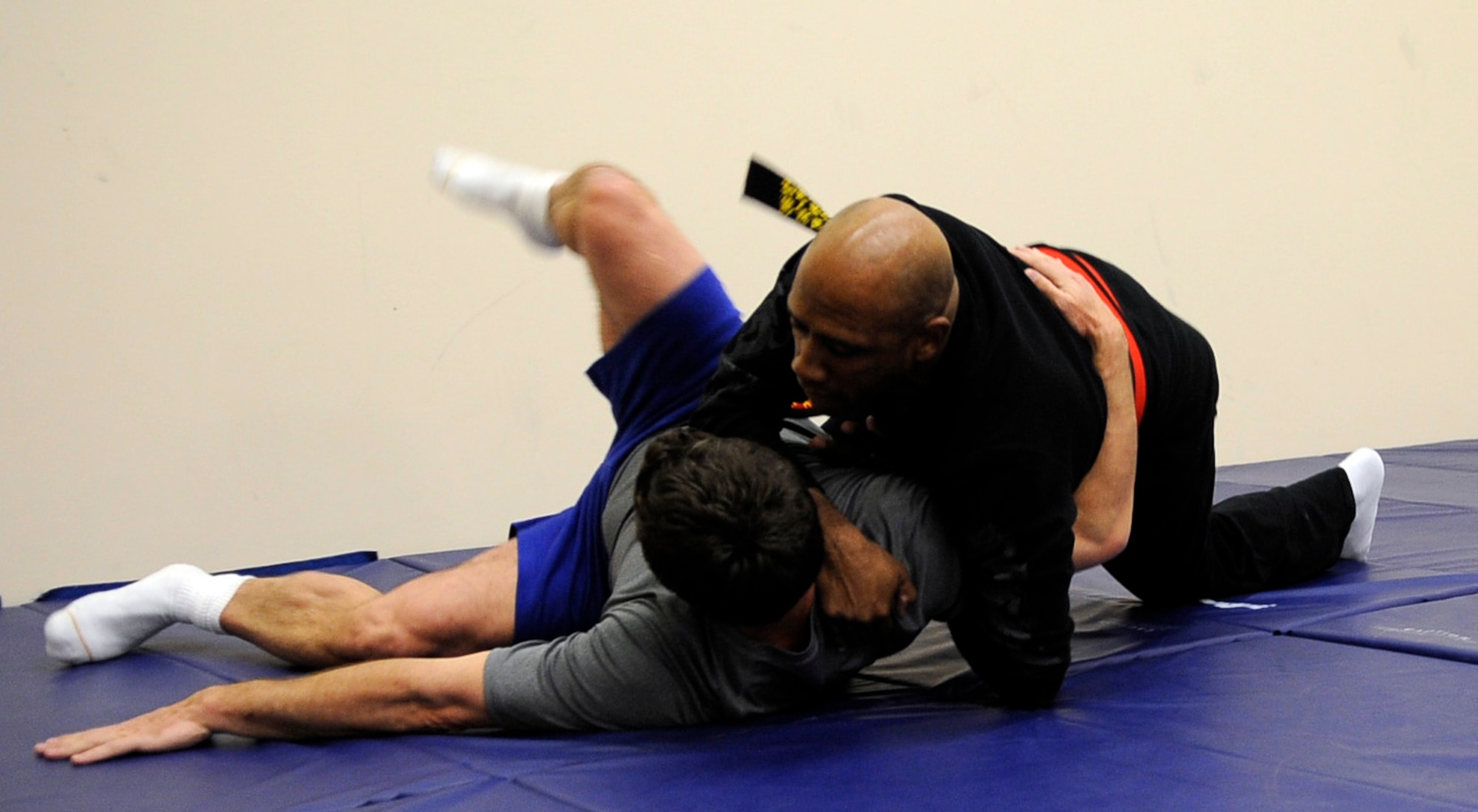 Col. Karlton Johnson demonstrates how to take down an attacker during a women's self-defense class May 16, 2011, Eielson Air Force Base, Alaska. The class taught women techniques to escape an attacker. Colonel Johnson is the 354th Mission Support Group commander. (U.S. Air Force photo/Airman 1st Class Laura Goodgame) 