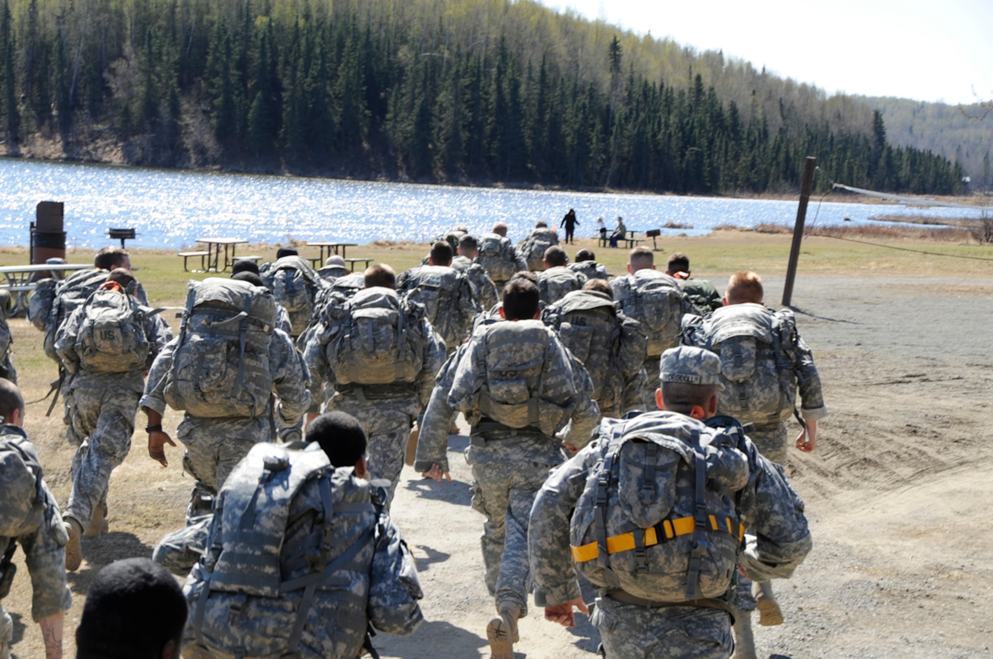 Soldiers assigned to  Joint Base ElmendorfIRichardson, Anchorage, Alaska participated in the years first 5K Combat-Cross Country Run. Running around Otter Lake carring 35 pound ruck sacks the  winner completed the course in 27 minutes 5 seconds. (U.S. Air Force photo/Steve White)