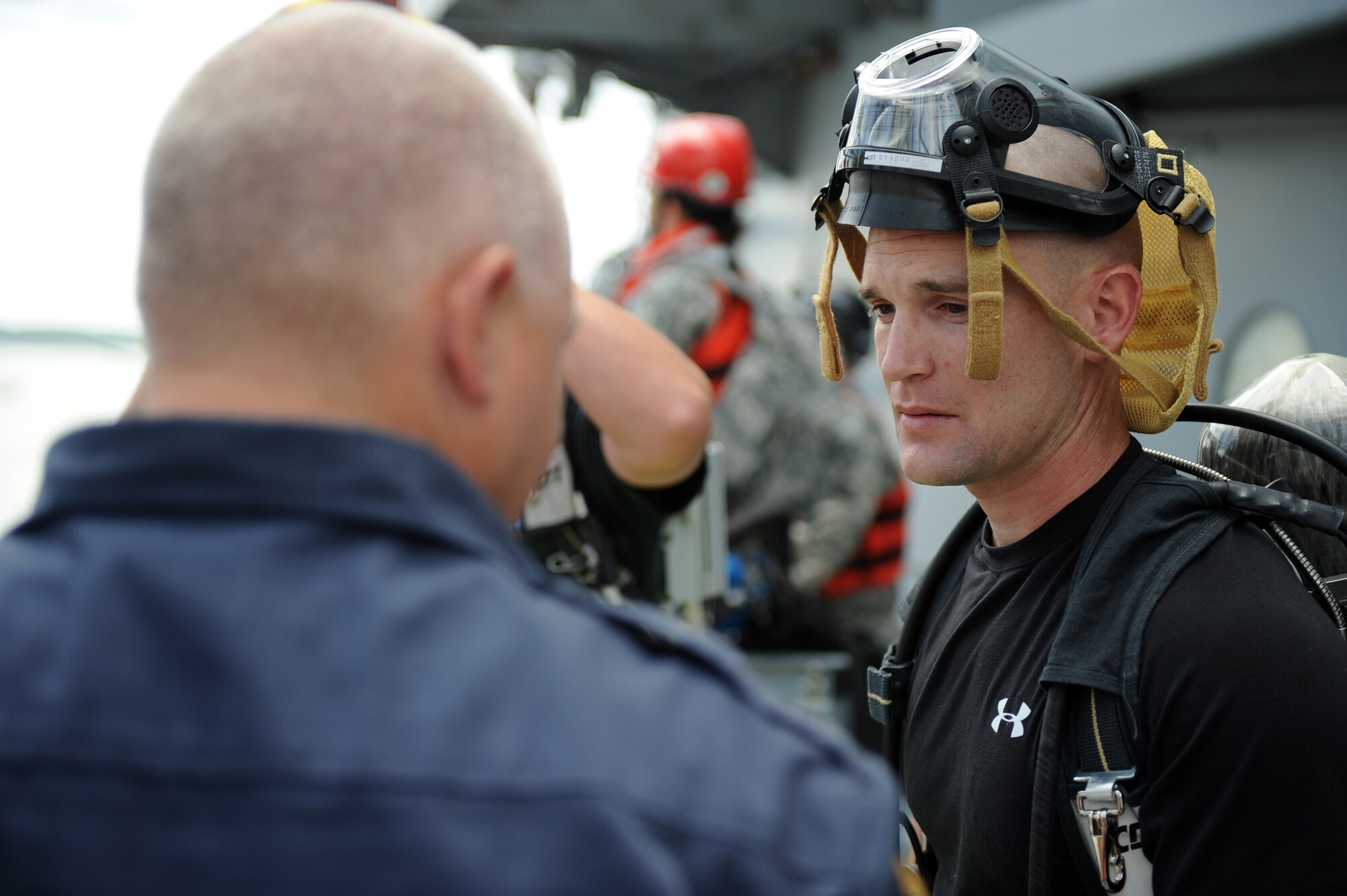 Trooper David Creath, Virginia State Police, receives a safety briefing before investigating suspicious substances on board the "Cape Johnson", the site for the first day of the Hampton Roads Full Scale Exercise staged off the coast of Fort Eustis, Va., May 17, 2011. The three day exercise strengthens anti-terrorism capabilities and tests local, state and federal response efforts in maritime, hostage and mass casualty scenarios.  (U.S. Air Force photo by Senior Airman Zachary Wolf)(RELEASED)
