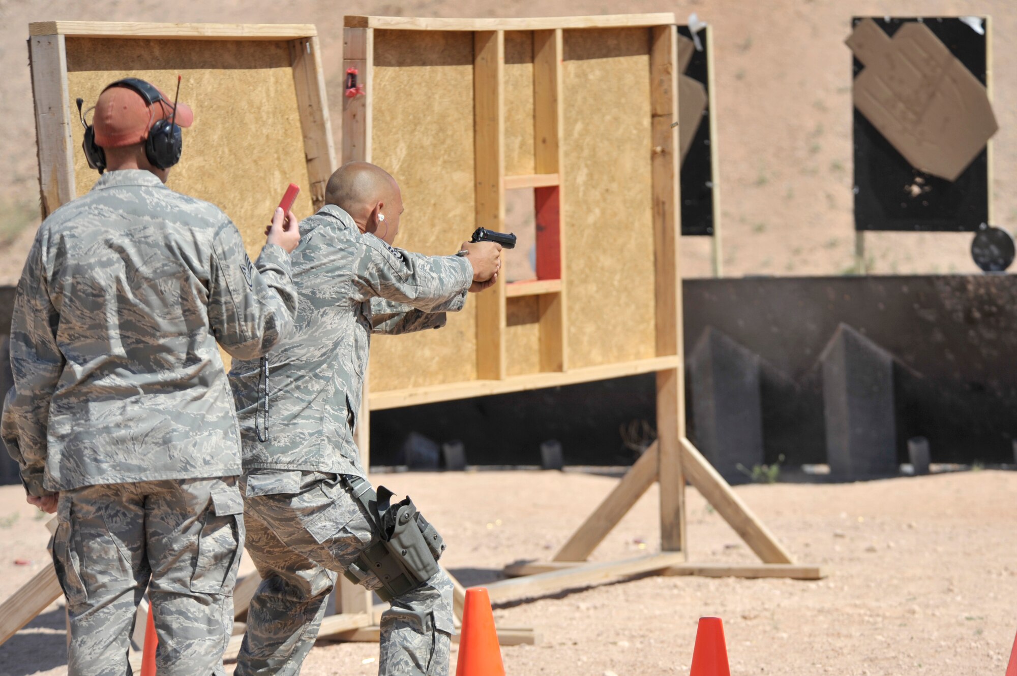 Master Sgt. Darrel Bailey, 27th Special Operations Security Forces Squadron, fires at a target while completing the shooting course at Patriot Outdoors in Clovis N.M., May 16, 2011. May 15 to May 21 is set aside for Police Week, an event designated to honor all of those serving in law enforcement. (U.S. Air Force photo by Airman Ericka Engblom)