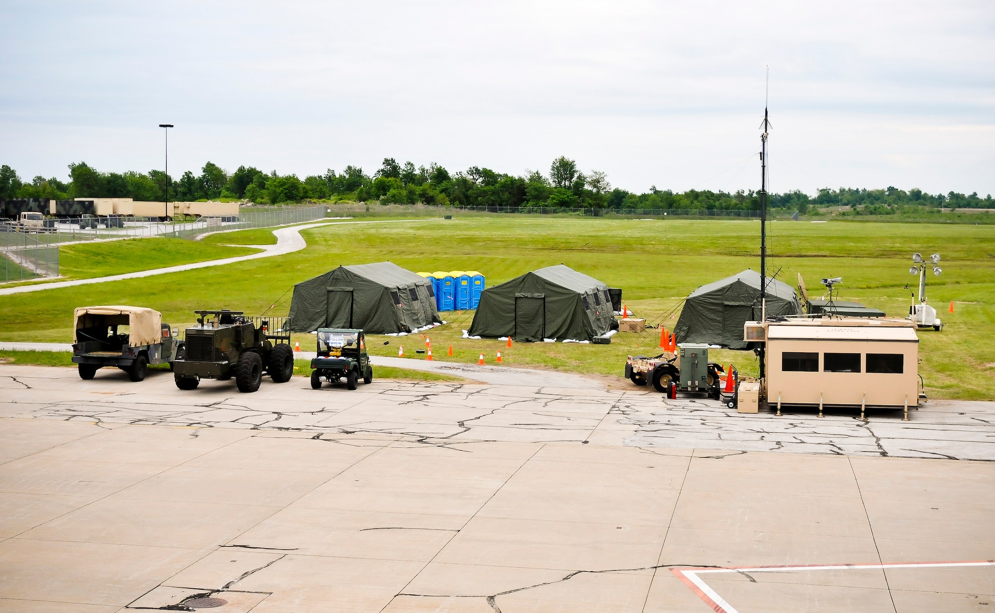 The 123rd Contingency Response Element’s command center for National Level Exercise 2011 is Located on the edge of the flight line at Springfield-Branson National Airport in Springfield, Mo. The CRE can land at a non-functional airport, secure a perimeter around the airfield, and set up a command center in which they can start directing other aircraft to land. National Level Exercise 2011 is based on a scenario involving a massive earthquake along the New Madrid fault line, requiring extensive aeromedical evacuation of injured patients. The 123rd CRE was responsible for establishing an initial-response air hub in Springfield during the exercise. (U.S. Air Force photo by Senior Airman Maxwell Rechel)