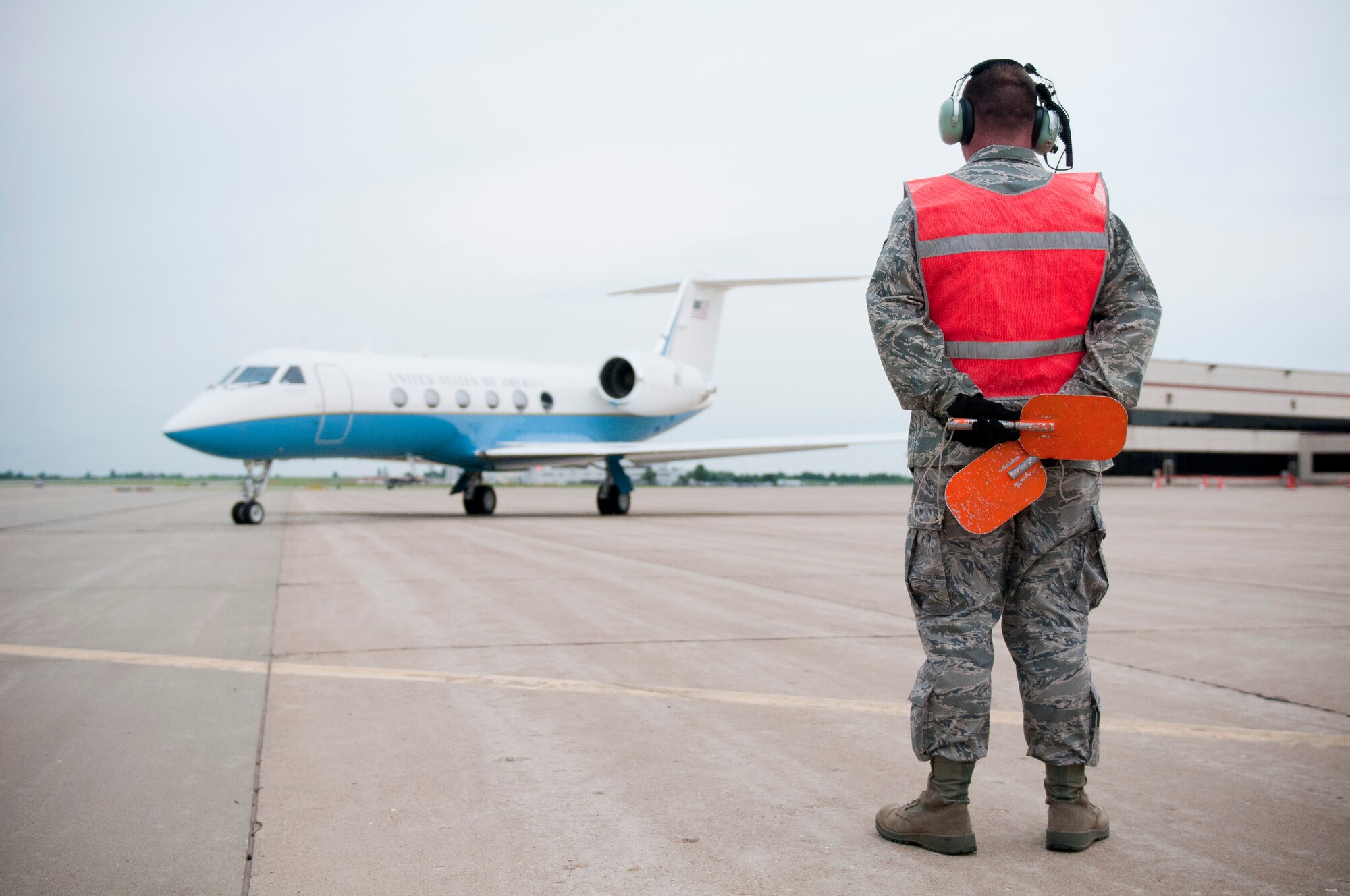 Sgt. Brandon Harris, a crew chief with the 123rd Contingency Response Element, Kentucky Air National Guard, marshals a Gulfstream G450 Jet at Springfield-Branson National Airport in Springfield, Mo., on May 18, 2011, during National Level Exercise 2011. On board is William Craig Fugate, director of the Federal Emergency Management Agency, who arrived in Springfield to take questions from news media about the exercise and view the collaboration between civil authorities and the Department of Defense. The exercise is based on scenario involving a massive earthquake along the New Madrid fault line. (U.S. Air Force photo by Senior Airman Maxwell Rechel)