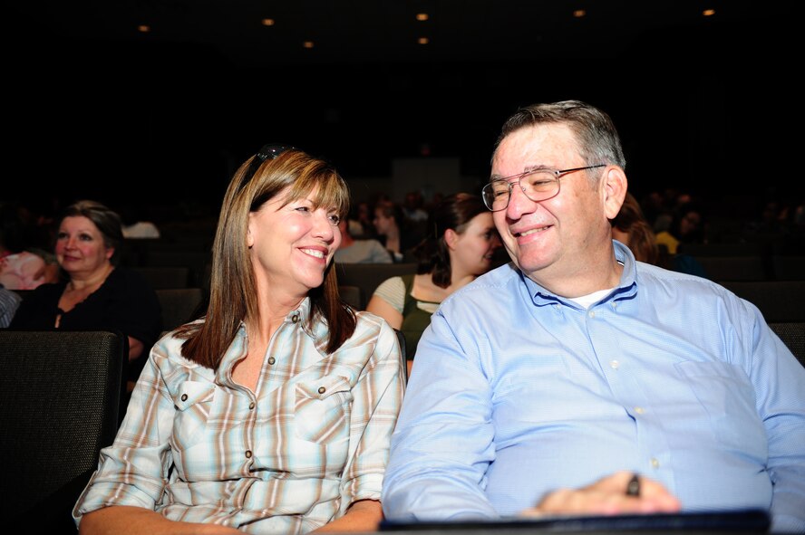 SEYMOUR JOHNSON AIR FORCE BASE, N.C. - Judine and Dr. Roy Heidicker participate in one of Dr. Gary Chapman's relationship improvement games during a seminar here, May 17, 2011.  Dr. Chapman has published more than 25 books to help improve relationships and family life. Dr. Heidicker, 4th Fighter Wing Historian, hails from Bellmore, N.Y., and his wife Judine hails from Norfolk, Va. (U.S. Air Force photo/Senior Airman Rae Perry)