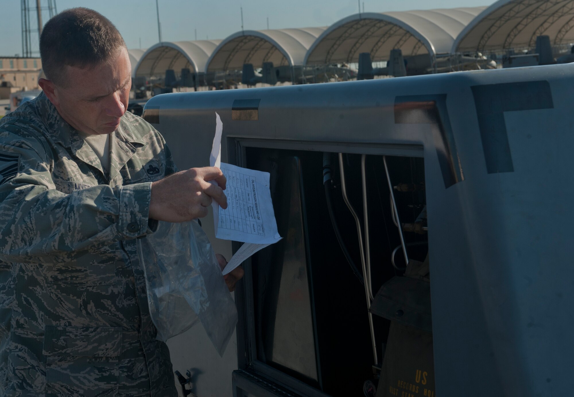 MOODY AIR FORCE BASE, Ga. -- Senior Master Sgt. Kenneth Myers, Air Combat Command aerospace ground equipment Logistics Compliance Assessment Program inspector, looks at an AF Technical Order Form 244 as he inspects a self-generating nitrogen servicing cart May 18. Inspectors reviewed many things including toolboxes, the way Airmen document equipment forms and how they follow procedures. (U.S. Air Force photo/Airman 1st Class Douglas Ellis)(RELEAESED)
