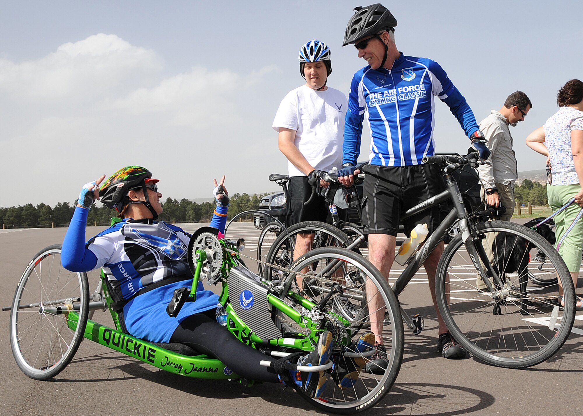 Jeanne Goldy-Sanitate, a retired staff sergeant and Air Force competitor in the 2011 Warrior Games, converses with Gen. William Shelton, the Commander of Air Force Space Command, and fellow Air Force competitor retired Staff Sgt. Gregory Miller, moments after they completed a six-mile cycling course May 9, 2011, at the Air Force Academy in Colorado Springs, Colo. General Shelton spoke with the team at their morning breakfast and then joined them for the cycling practice in the afternoon. (U.S. Air Force photo/Duncan Wood) 