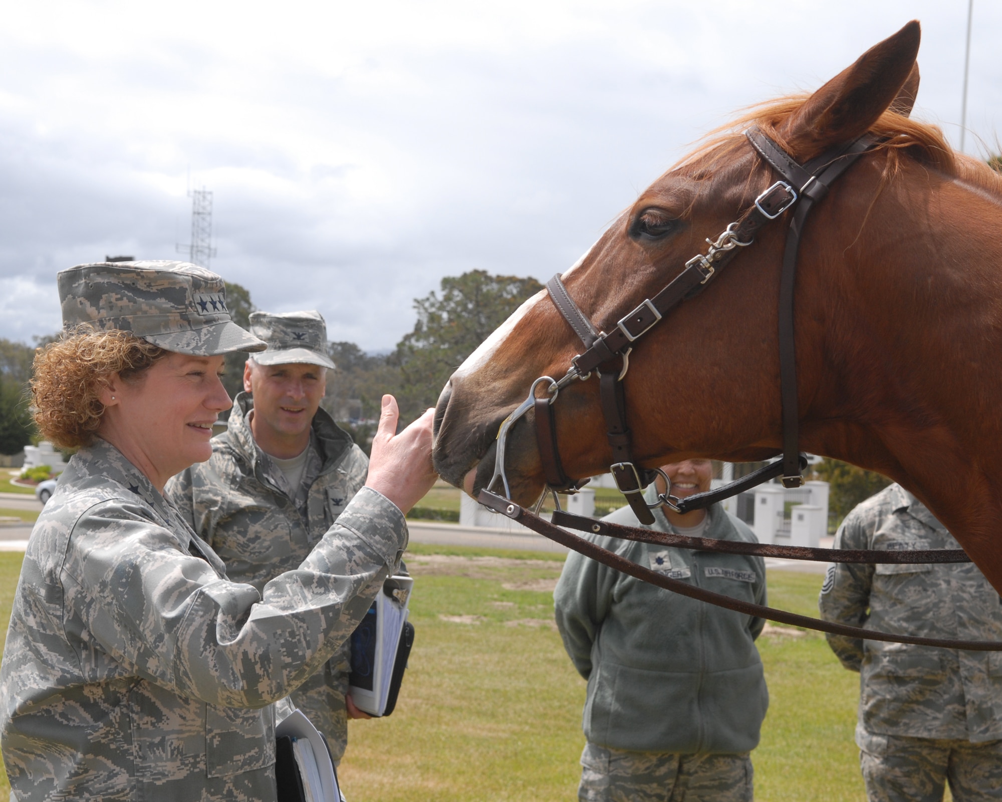 VANDENBERG AIR FORCE BASE, Calif. -- Lt. Gen. Susan Helms, Joint Functional Component Command for Space and 14th Air Force commander, introduces herself to Snickers, one of the horses in Vandenberg’s mounted horse unit during her immersion tour Tuesday, May 17, 2011. The mounted patrol, the only one of its kind in the Air Force, provides numerous vital roles for base operations to include search and rescue; patrols into base territory that all terrain vehicles cannot access; consequence management for protests; pre-launch sweeps; and beach patrols. The  horses are also trained in criminal pursuit and attainment.  (U.S. Air Force photo/Jerry E. Clemens, Jr.)
