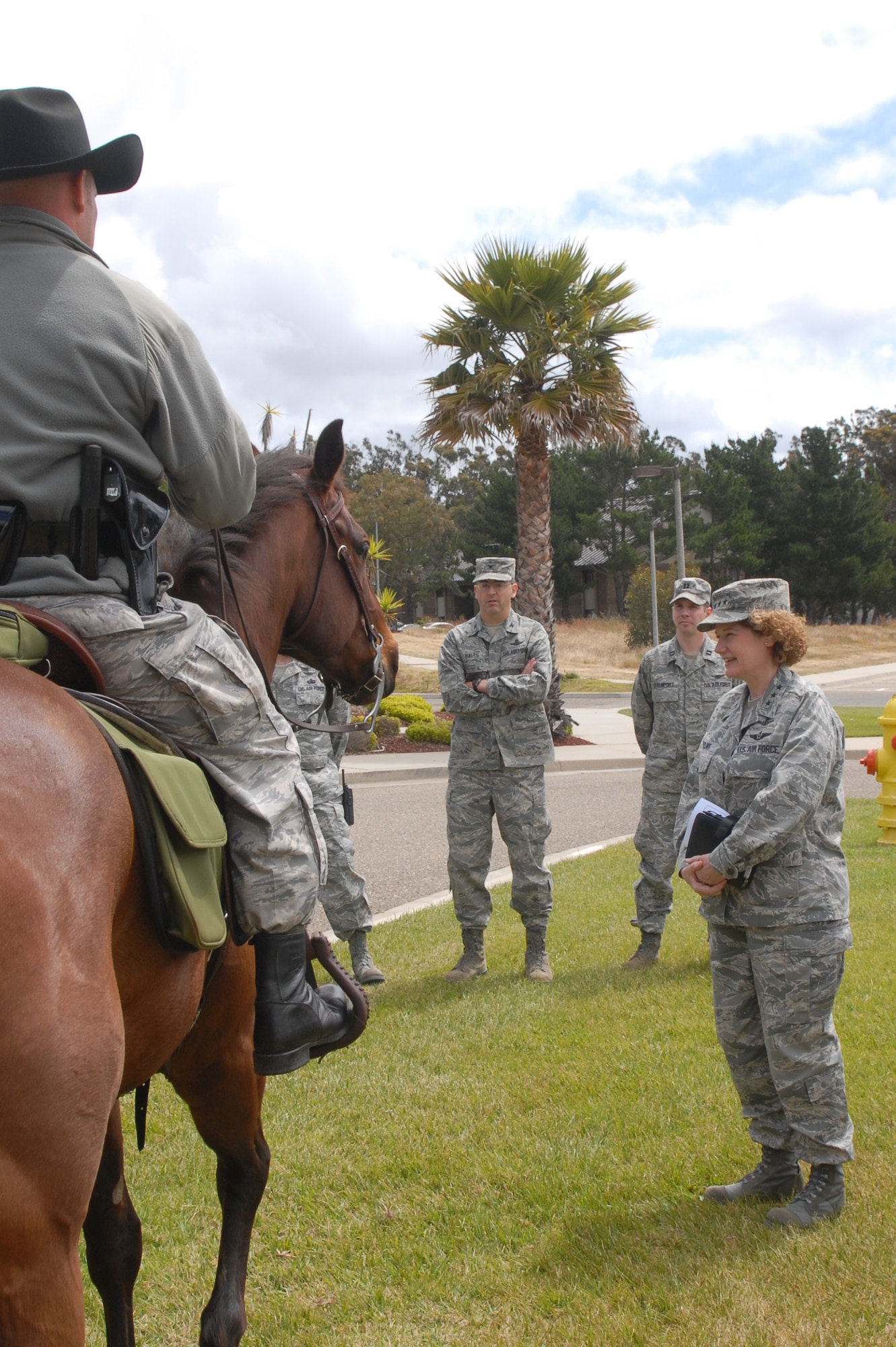 VANDENBERG AIR FORCE BASE, Calif. -- Lt. Gen. Susan Helms, Joint Functional Component Command for Space and 14th Air Force commander, learns about Trooper and Snickers, two of the horses in Vandenberg’s mounted horse unit during her immersion tour Tuesday, May 17, 2011. The mounted patrol, the only one of its kind in the Air Force, provides numerous vital roles for base operations to include search and rescue; patrols into base territory that all terrain vehicles cannot access; consequence management for protests; pre-launch sweeps; and beach patrols. The  horses are also trained in criminal pursuit and attainment.  (U.S. Air Force photo/Jerry E. Clemens, Jr.)