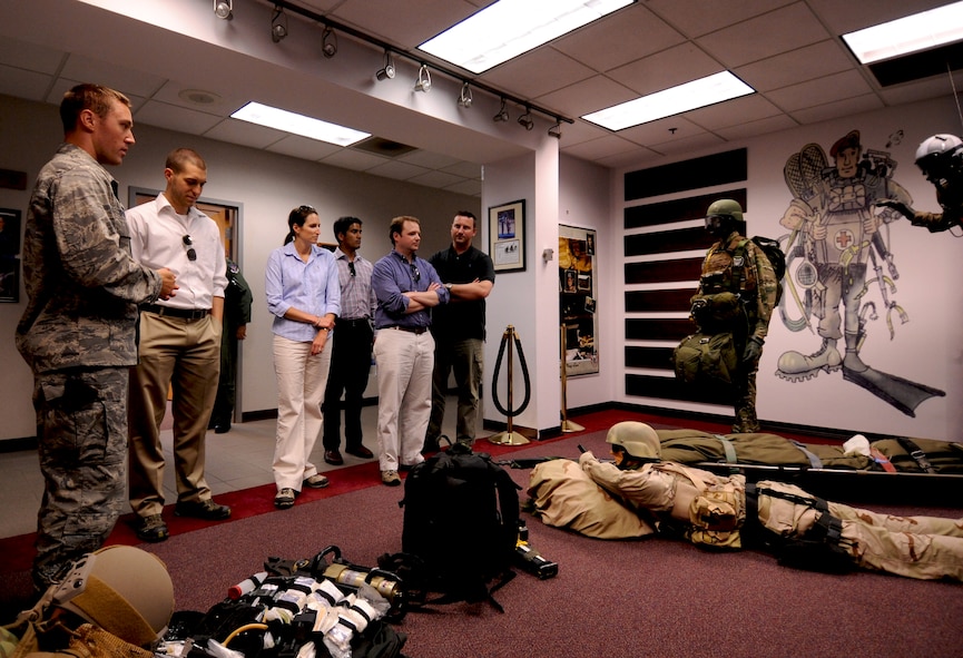 Six Congressional Staff members tour the 38th Rescue Squadron with Maj. Patrick Gruber, 38th RQS director of operations, during their visit to Moody Air Force Base, Ga., May 17. The staff members visited to further understand Moody’s contributions to the fight in Afghanistan and other contingency operations around the globe. (U.S. Air Force photo/Airman 1st Class Benjamin Wiseman)(RELEASED)