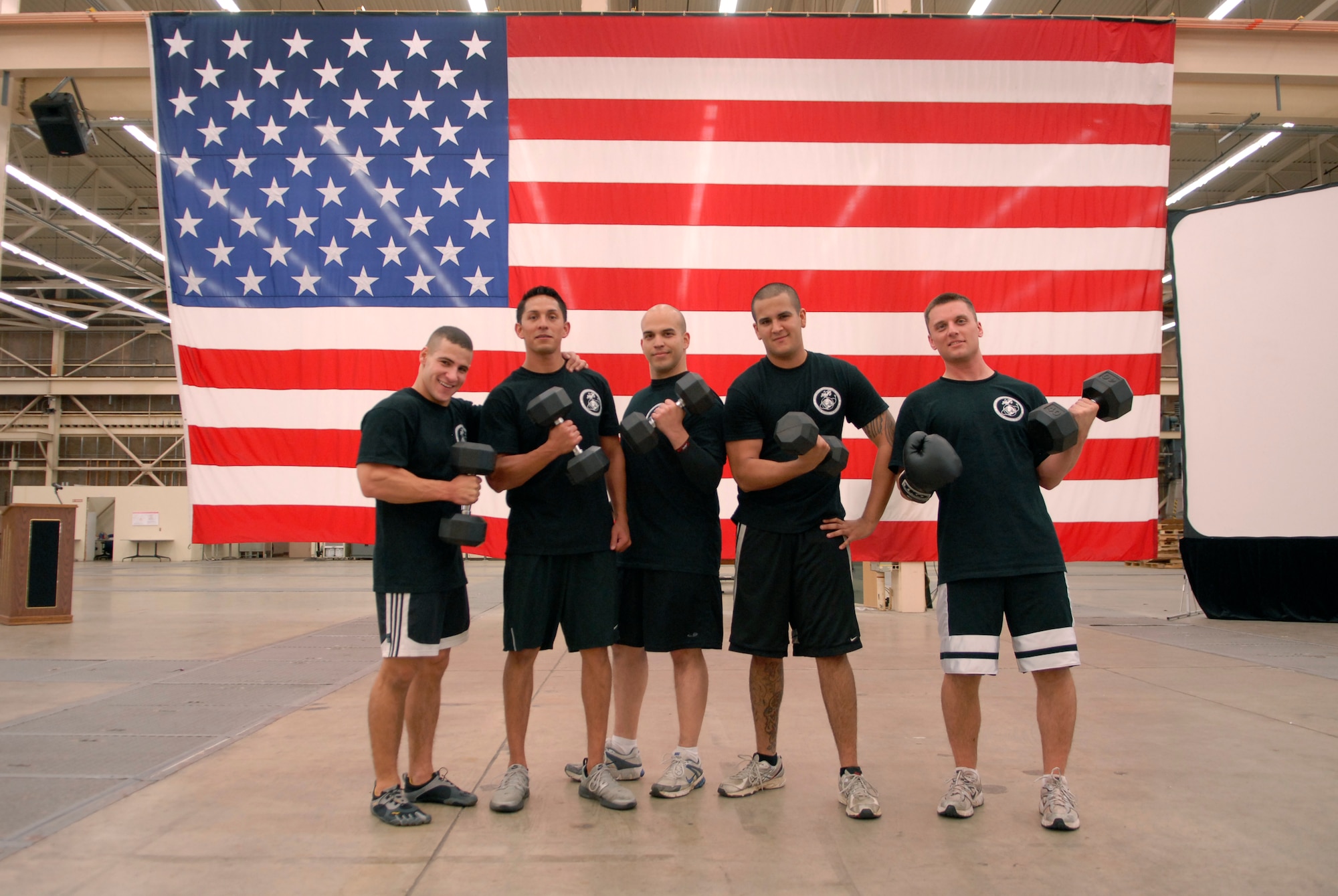 VANDENBERG AIR FORCE BASE, Calif. -- Posing for a photo, Staff Sgt. Brandon Lirio, a 614th Air and Space Operations Center member, Air National Guard Tech. Sgt. Alexander Hernandez, Staff Sgt. Reuben Peralta, Army Sgt. Daniel Pineda, and Tech. Sgt. Gavin Iteen, take a breath after finishing their training session for the upcoming Tough Mudder competition here Monday, May 16, 2011.  The joint team will compete in Snow Valley, in an extreme obstacle race testing the team's endurance, overall strength and teamwork.  (U.S. Air Force photo/Staff Sgt. Andrew Satran) 

   
 
 
 