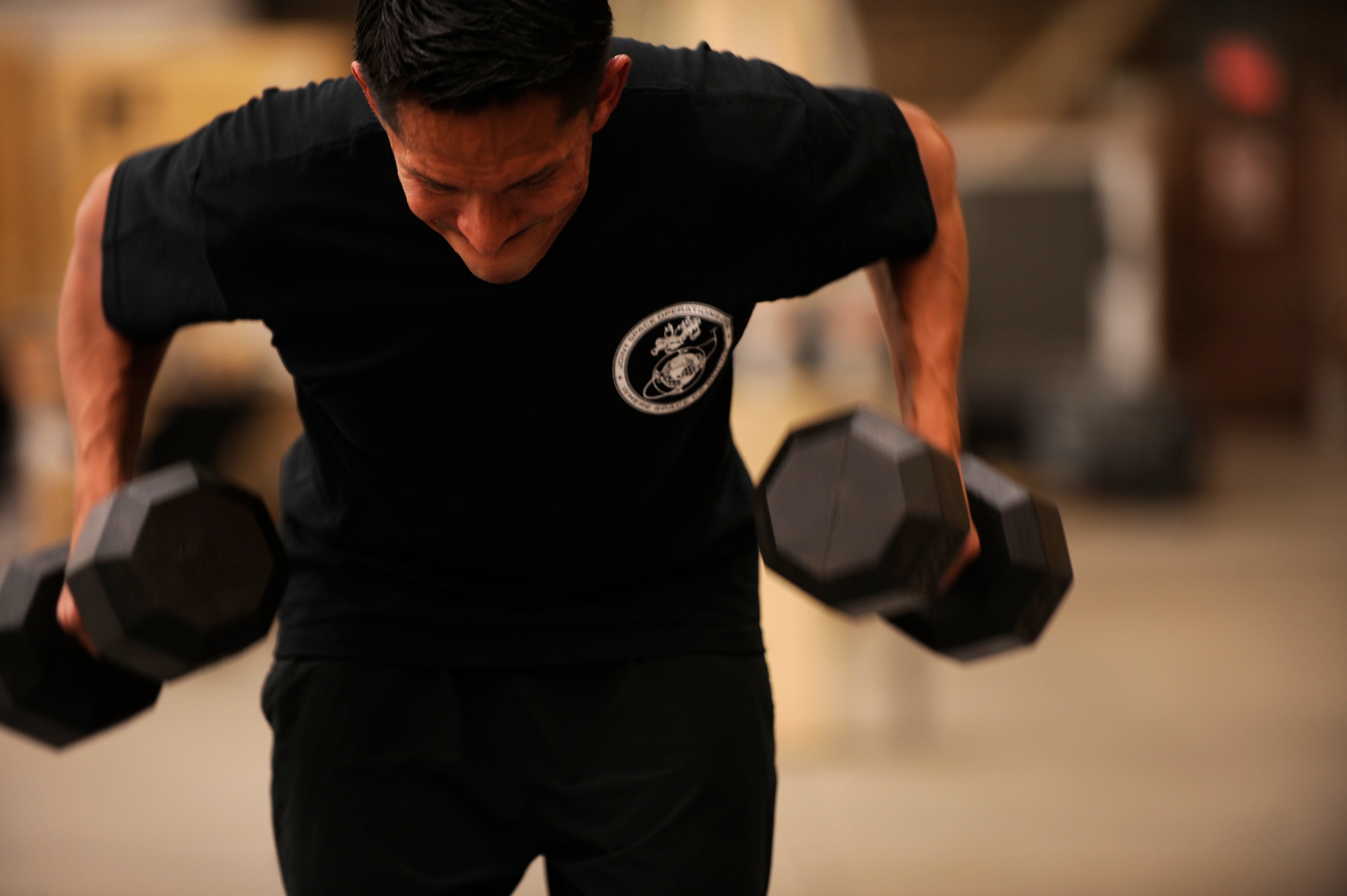 VANDENBERG AIR FORCE BASE, Calif. -- Air National Guard Tech. Sgt. Alexander Hernandez, a 614th Air and Space Operations Center  member here, pumps iron during a training session for the upcoming Tough Mudder competition in Snow Valley here Monday, May 16, 2011.  The joint team came together to build camaraderie and improve their physical fitness.  (U.S. Air Force photo/Staff Sgt. Andrew Satran) 

 
 