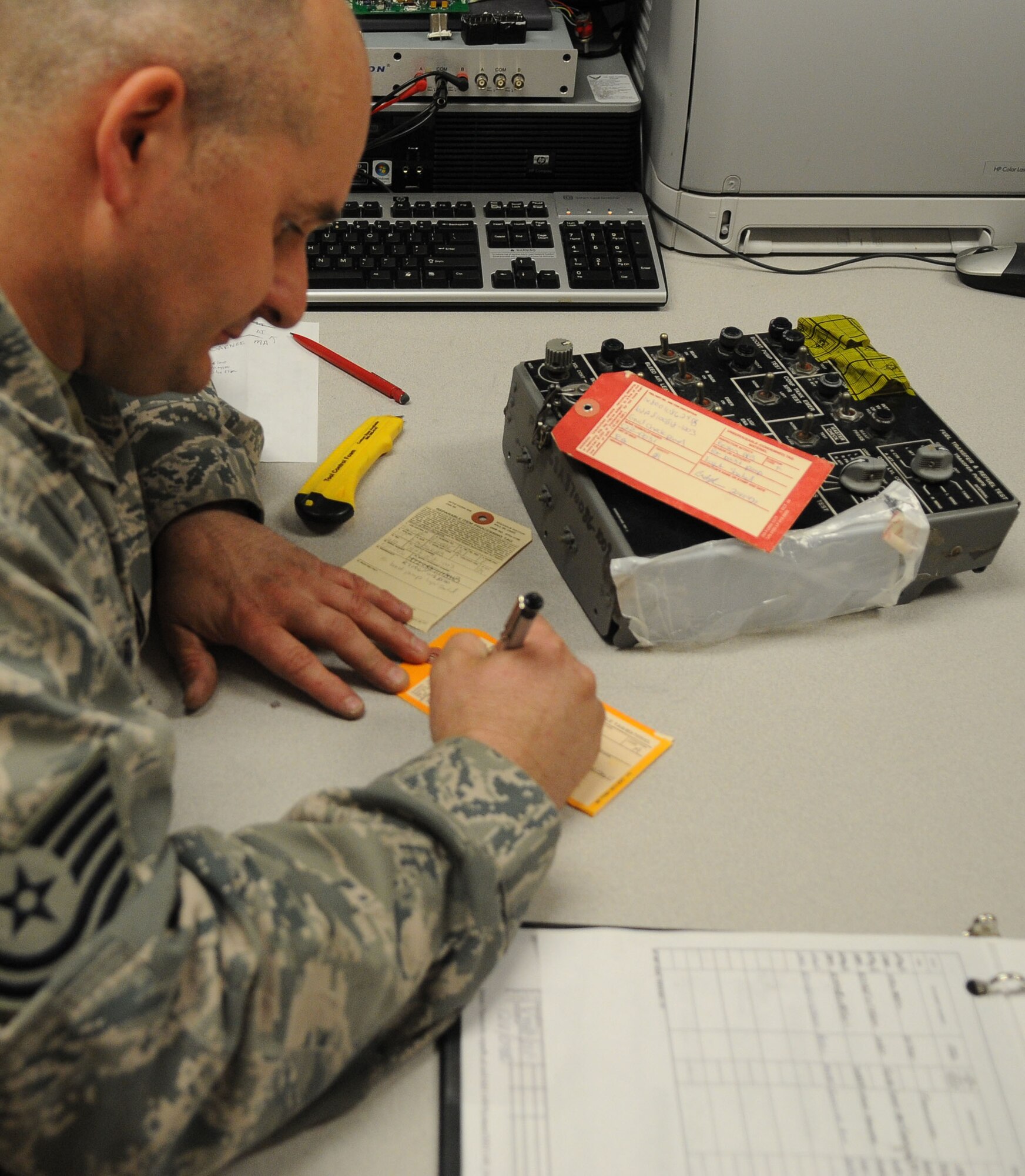 Tech. Sgt. Kevin Marshall turns in a previously condemned asset as serviceable May 12, 2011, Eielson Air Force Base, Alaska. The 354th Aircraft Maintenance Squadron repairs items that have been previously condemned or red tagged so the parts can be used again. Sergeant Marshall is the Air Force repair enhancement program manager assigned to the 354th AMXS. (U.S. Air Force photo/A1C Janine Thibault)