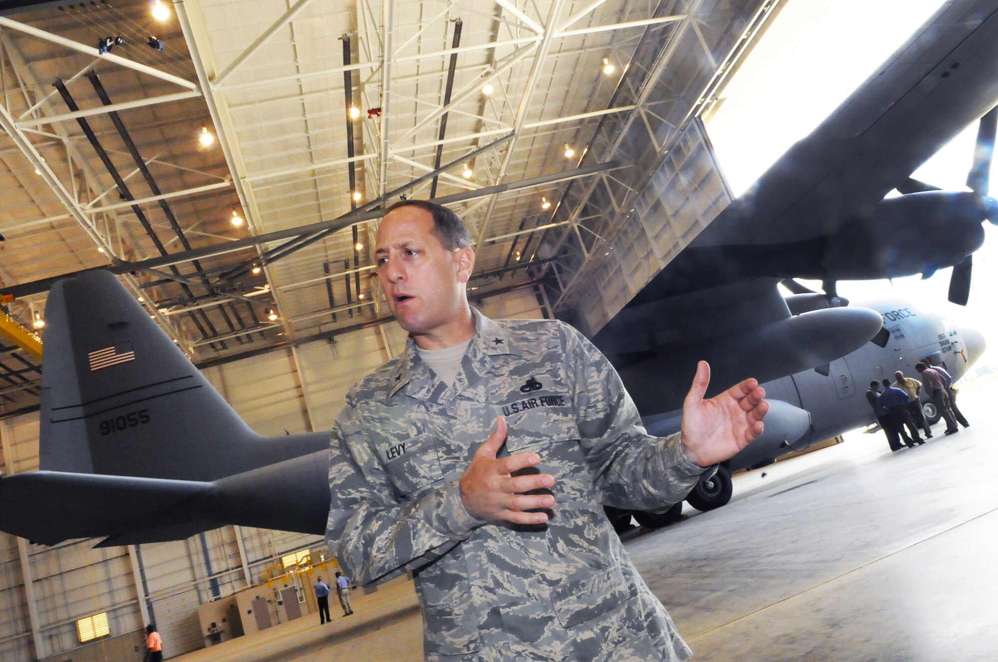 Brigadier General Lee K. Levy, 402nd Maintenance Wing commander, talks about the features of the new 86,000 sq. ft., $24.1 million maintenance hangar at opening ceremonies for the new facility. The hangar will help with both the Center's ongoing C-130 center wing box workload and new C-130J program depot maintenance workload.  U. S. Air Force photo by Sue Sapp 