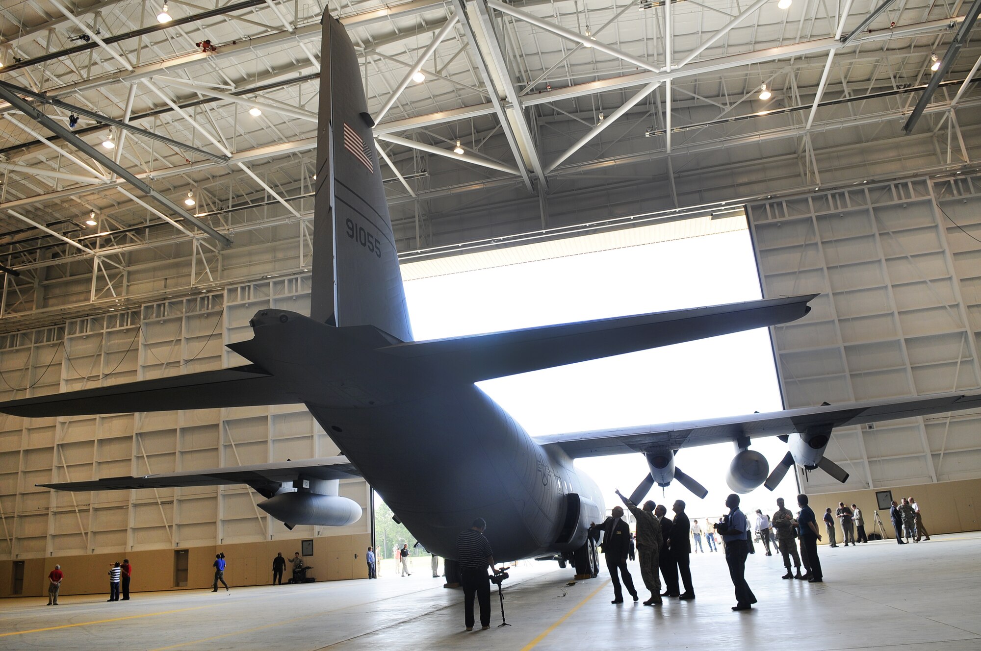 The ribbon was cut on a new 86,000 sq. ft., $24.1 million maintenance hangar at opening ceremonies for the new facility May 13. The hangar will help with both the Center's ongoing C-130 center wing box workload and new C-130J program depot maintenance workload.  U. S. Air Force photo by Sue Sapp
