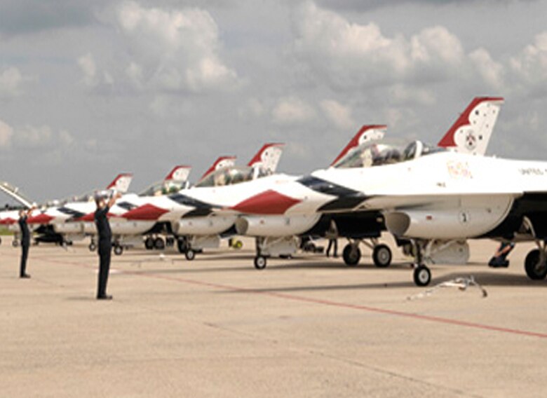 Maintainers signal to returning Thunderbirds pilots May 16, 2011, during a practice run for an upcoming aerial show during the Joint Services Open House May 20 to 21, 2011, at Andrews Air Force Base, Md. During the show, the Thunderbirds plan to fly with Camelina-based hydrotreated renewable jet fuel. (U.S. Air Force photo/Staff Sgt. Tiffany Trojca)