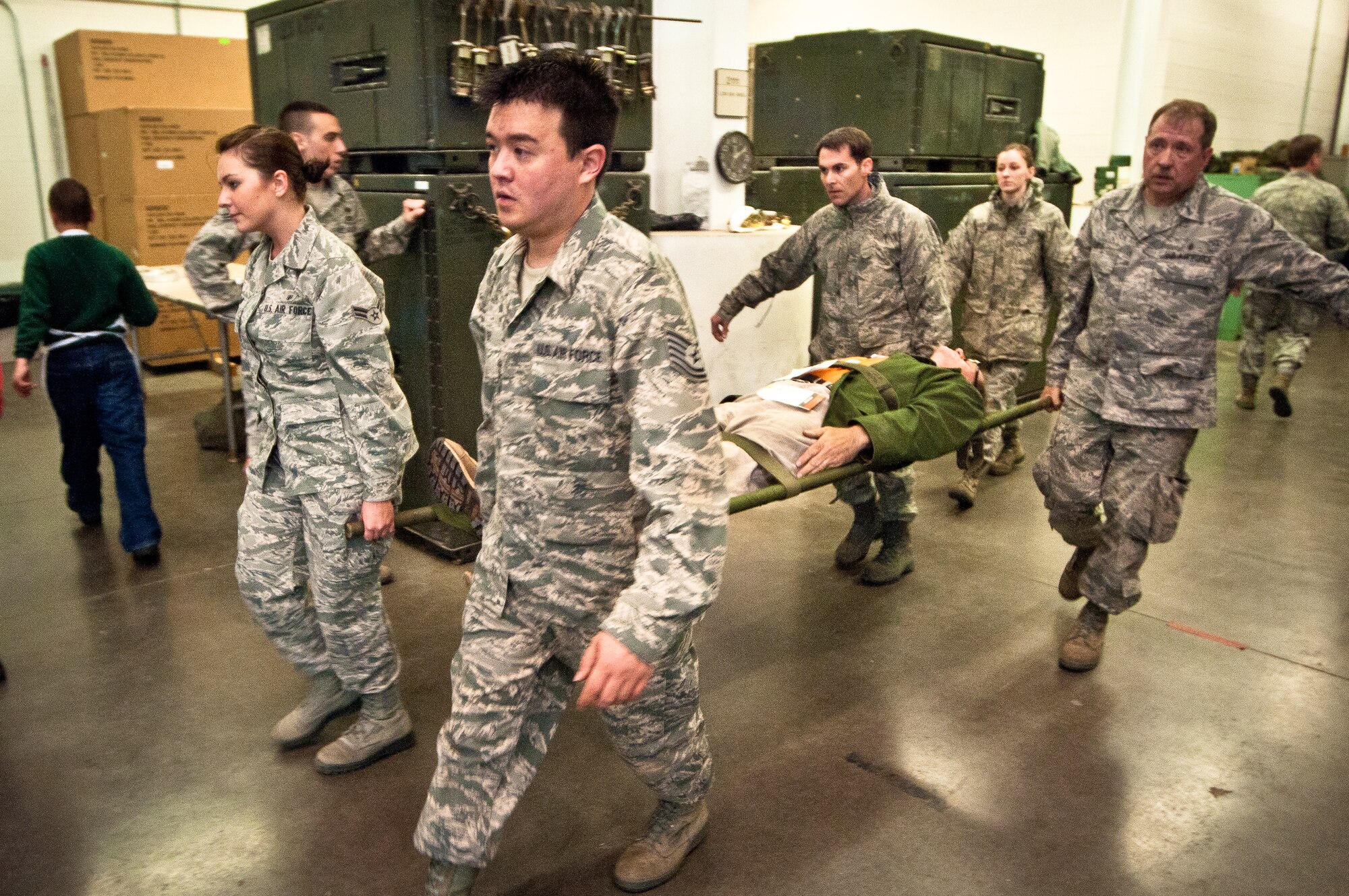 Members of the Kentucky Air National Guard’s 123rd Medical Group carry a patient litter to a simulated field clinic during earthquake-response exercises held May 18, 2011, at the Kentucky Air National Guard Base in Louisville, Ky. The exercises were designed to test the ability of the Department of Veterans Affairs and the Kentucky Air Guard to provide medical care following a major earthquake along the New Madrid fault line. (U.S. Air Force photo by Maj. Dale Greer)