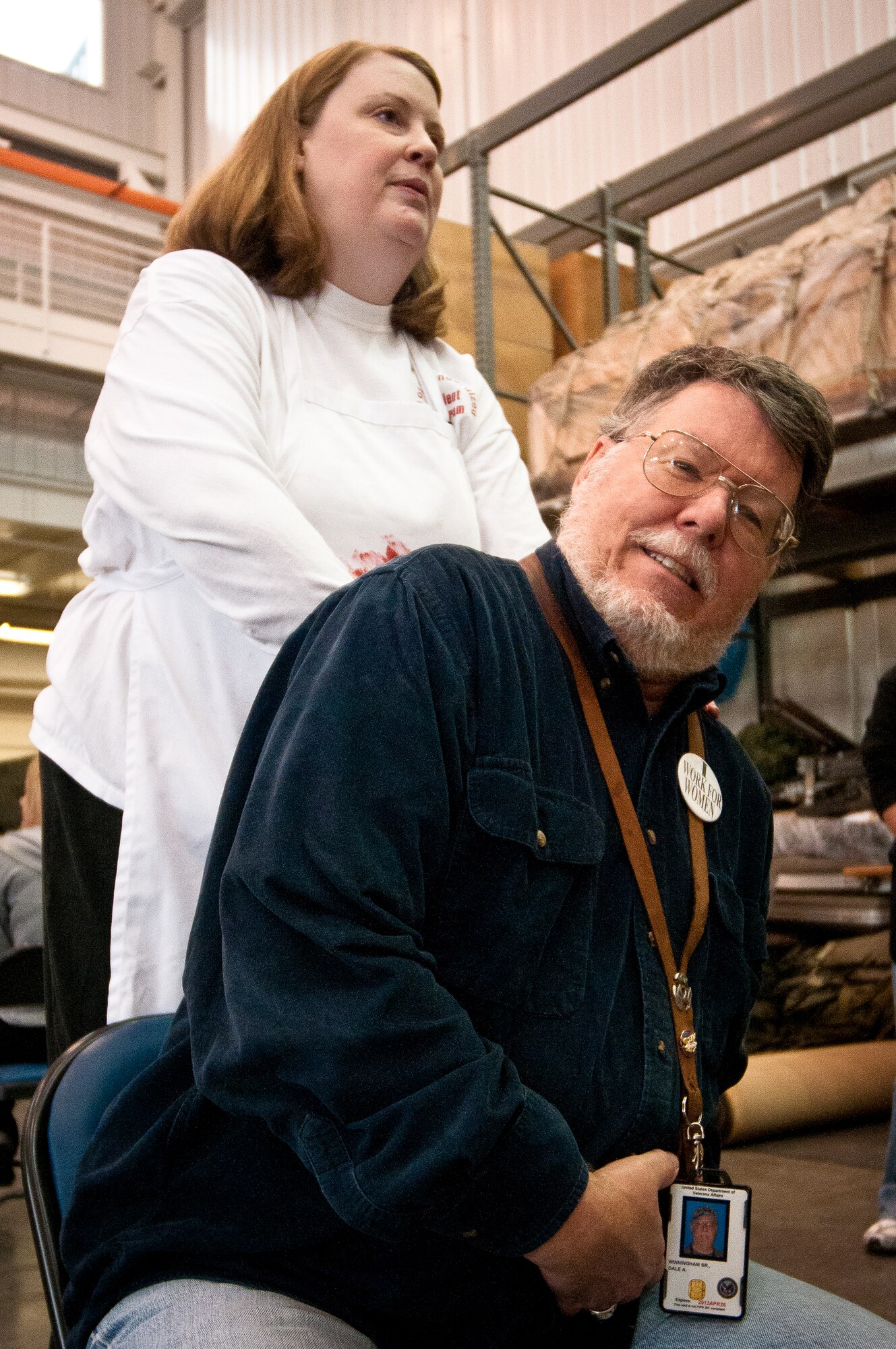 Dale Winningham, a volunteer for the National Disaster Medical System, practices labored breathing in preparation for earthquake-response exercises held May 18, 2011, at the Kentucky Air National Guard Base in Louisville, Ky., as patient-simulation expert Gina Wesley instructs him on how he would act if he had a collapsed lung. The exercises were designed to test the ability of the Department of Veterans Affairs and the Kentucky Air Guard to provide medical care following a major earthquake along the New Madrid fault line. (U.S. Air Force photo by Maj. Dale Greer)