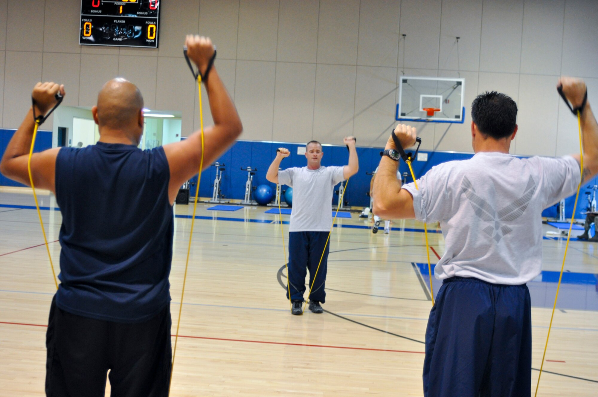 U.S. Air Force Staff Sgt. Daniel Bedford leads an arm-strengthening exercise during a four-day Cooper Institute Military Exercise Leader course at March Air Reserve Base, Calif., May 10, 2011.  The course is part of an ongoing effort to create a culture of fitness at the base.  (U.S. Air Force photo/ Megan Just)