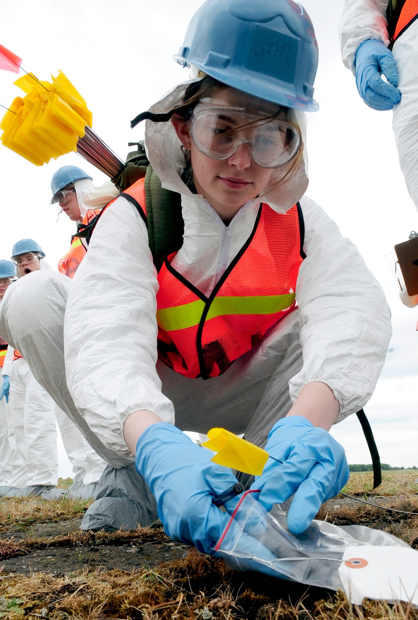 RAF HONINGTON, England -- Staff Sgt. Courtney Stamper, RAF Mildenhall Installation Search and Recovery Team, collects simulated personal remains during the response to a mock plane crash during a major accident response exercise held at RAF Honington May 18, 2011. The search and recovery team takes care to handle the remains with dignity and respect so that they can be returned to their loved ones.(U.S. Air Force photo/Senior Airman Ethan Morgan)