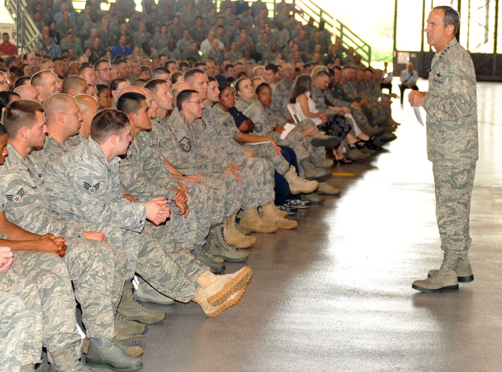 Gen. Raymond Johns, Air Mobility Command commander, speaks with Team Scott during his all-call May 12, 2011 at Hangar 1 on Scott Air Force Base, Ill.  During the all-call, General Johns talked to Airmen from the 375th Air Mobility Wing about the Global Vigilance of AMC and the importance of Comprehensive Airmen Fitness in building resilient Airmen. (U.S. Air Force photo/ Airman 1st Class Divine Cox)