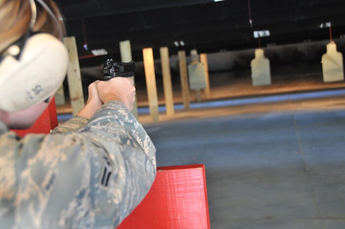 Airman 1st Class Evelyn Wilhems, a medical logistics journeyman from the 628th Medical Group and a 628th Security Forces Squadron augmentee, points down the range with an M-9 during a qualification training May 18, at Joint Base Charleston – Air Base. She and 25 other Airmen were in training to become Security Forces augmentees. Special thanks to all of the men and women who took into account ‘service before self’ by volunteering to become an augmentee during a time of need. 