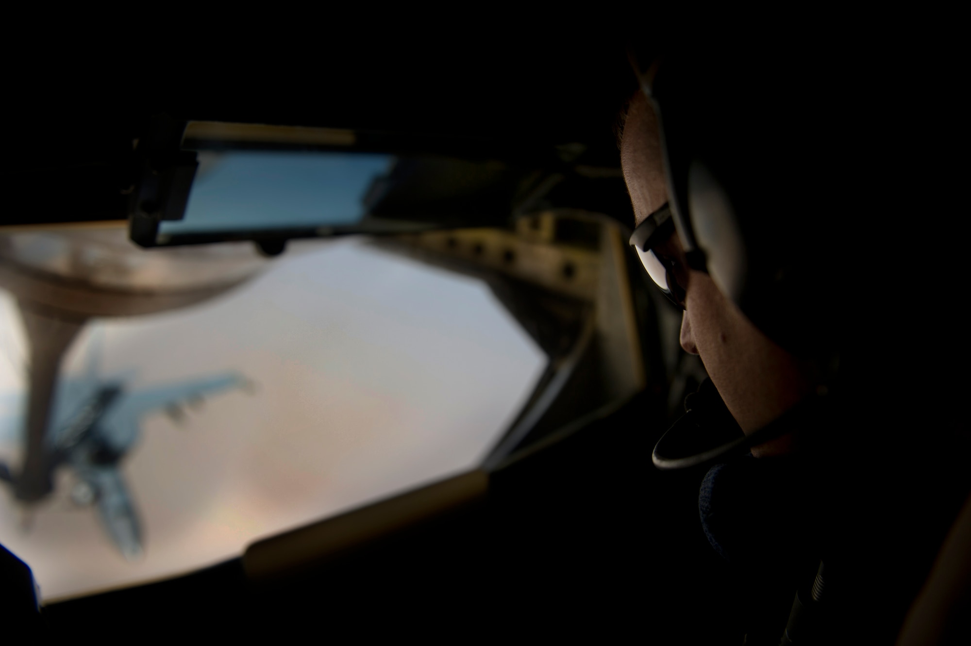 Staff Sgt. Raymond Johnson, 340th Expeditionary Air Refueling Squadron Detachment 4 boom operator, refuels a Navy F-18 Hornet over the skies of Iraq in support of Operation New Dawn. Sergeant Johnson is deployed from the 911th Air Refueling Squadron, Seymour Johnson Air Force Base, N.C. (U.S. Air Force  photo/Master Sgt. Adrian Cadiz)(Released)

 