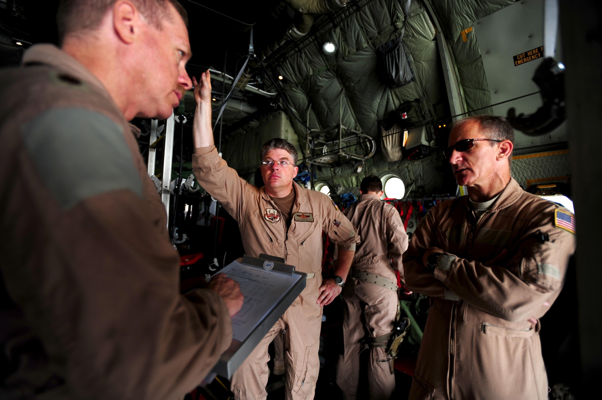 Lt. Col. Larry Kroecker, 746th Expeditionary Airlift Squadron pilot, conducts a preflight brief with aeromedical evacuation aircrew from the 379th Expeditionary Aeromedical Evacuation Squadron prior to take off on an aeromedical evacuation mission supporting Operation New Dawn, May 5, 2011. 