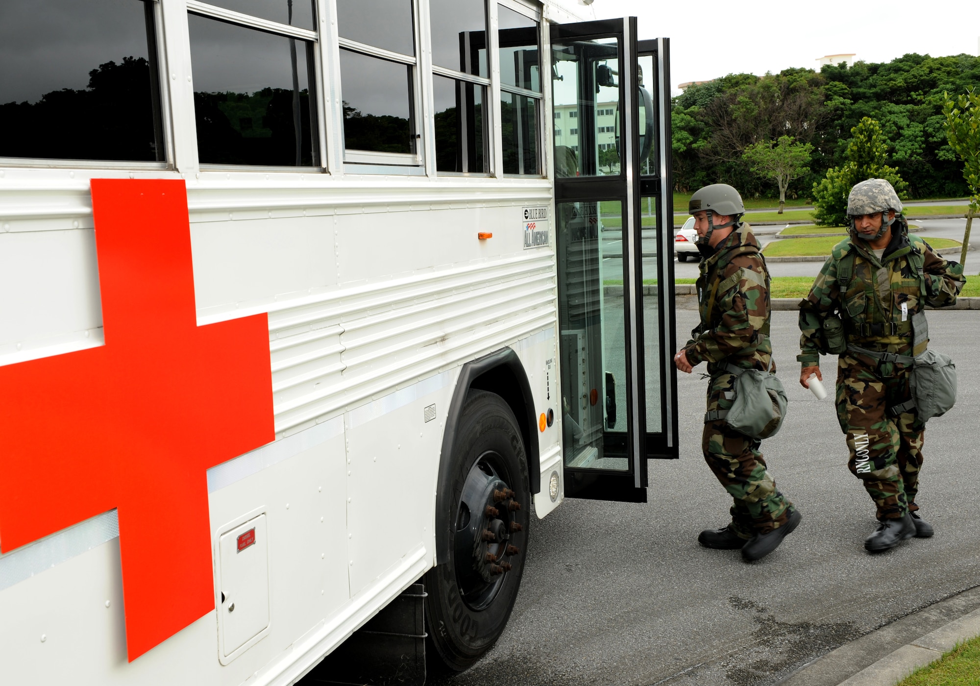 Treated patients load a bus going to the contamination control center after being food poisoning as part of local operational readiness exercise Beverly High 11-4, May 19, at Kadena Air Base, Japan. Kadena's personnel are participating in the LORE to stay prepared for real world contingencies. (U.S. Air Force photo/Junko Kinjo)