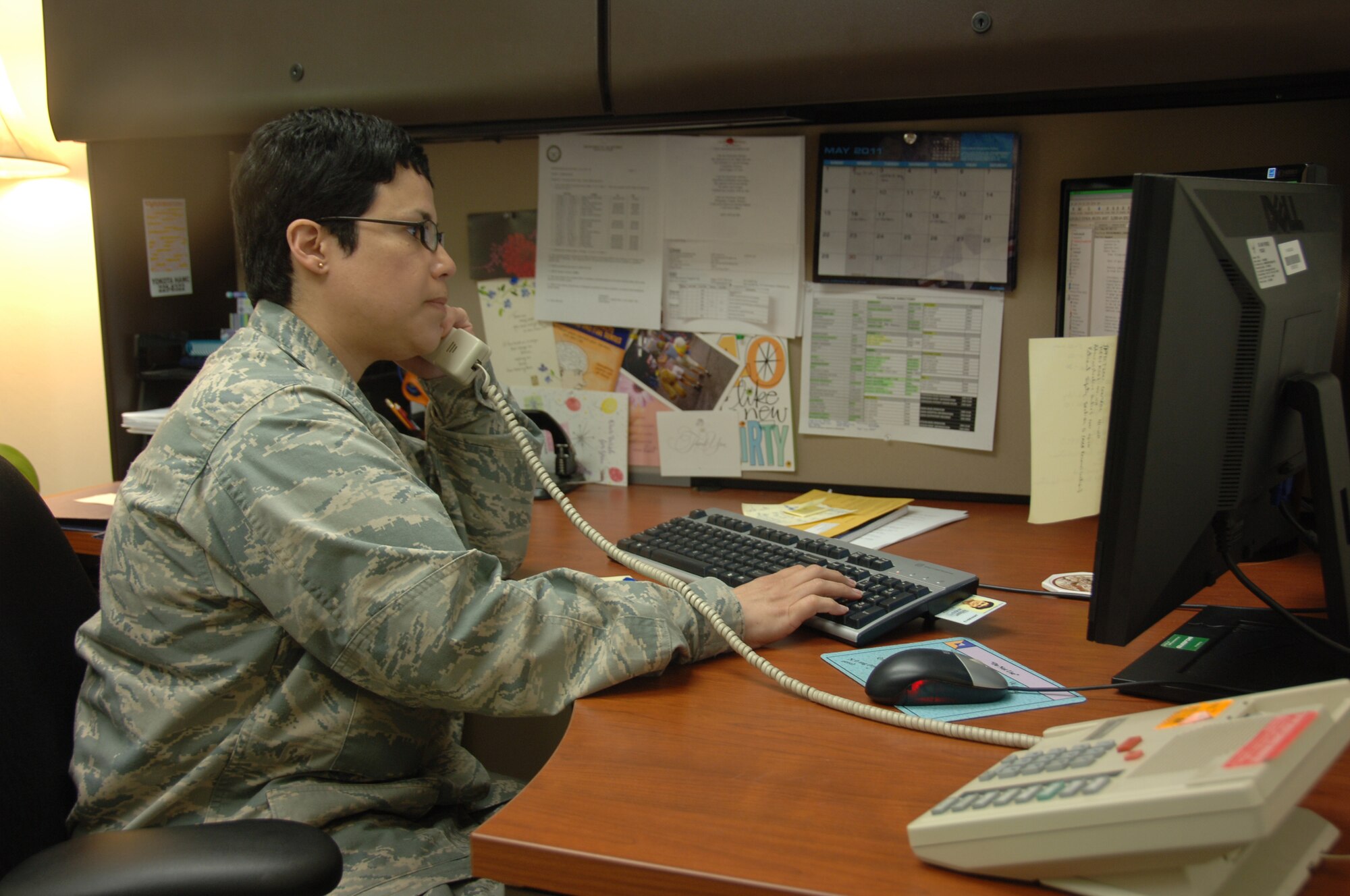 YOKOTA AIR BASE, Japan -- Capt. Lorraine Rivera, 374th Medical Operatons Squadron clinical nurse, spends part of her day answering questions for patients over the phone with a program called TeleHealth, at Yokota Air Base, Japan, May 13, 2011. Capt. Rivera, a native of Puerto Rico, has always been interested in medicine. (U.S. Air Force Photo/Airman 1st Class Katrina R. Menchaca)