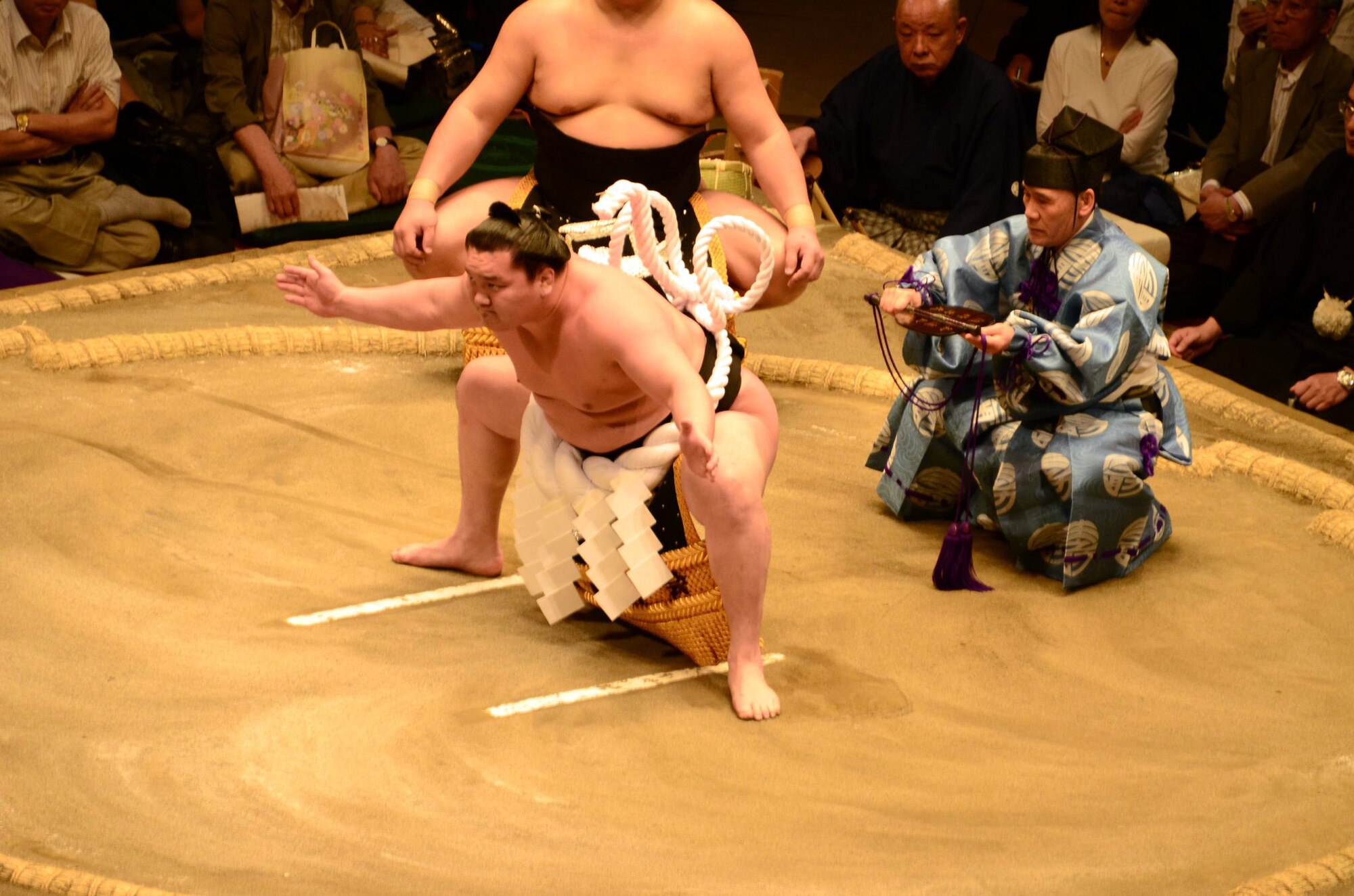 YOKOTA AIR BASE, Japan – A Yokozuna, the highest rank of Sumo wrestler, begins the Dohyo-iri, “ring purification” at a Sumo tournament held at the Ryogoku Kokugikan, Tokyo, Japan, May 14, 2011. More than 150 members of the Yokota family were invited to witness Japan’s national sport first hand. (Courtesy Photo)