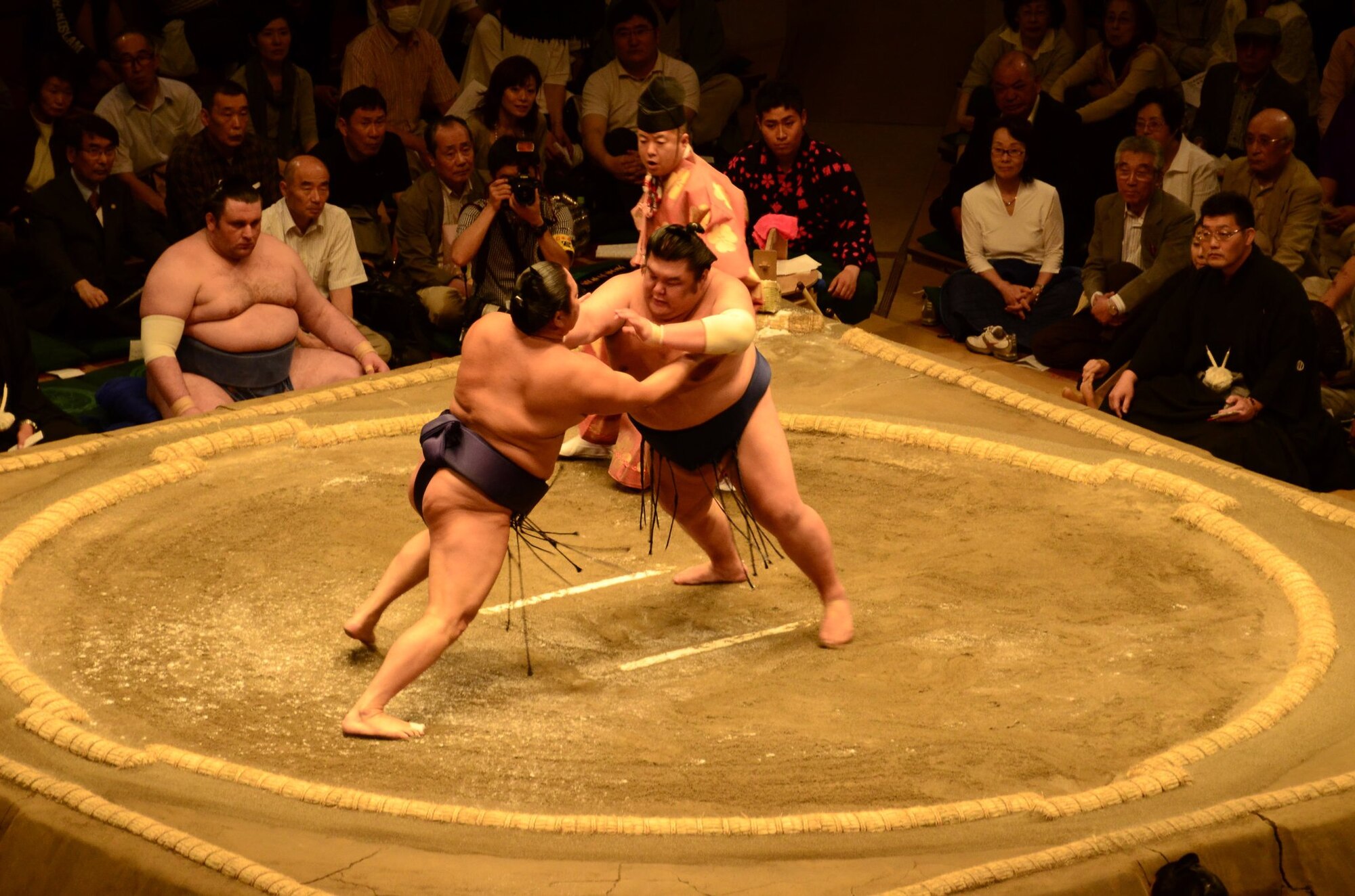 YOKOTA AIR BASE, Japan – Two Sumo wrestlers collide in a show of skill and balance during a Sumo tournament held at the Ryogoku Kokugikan, Tokyo, Japan, May 14, 2011. More than 150 members of the Yokota family were invited to witness Japan’s national sport first hand. (Courtesy Photo)