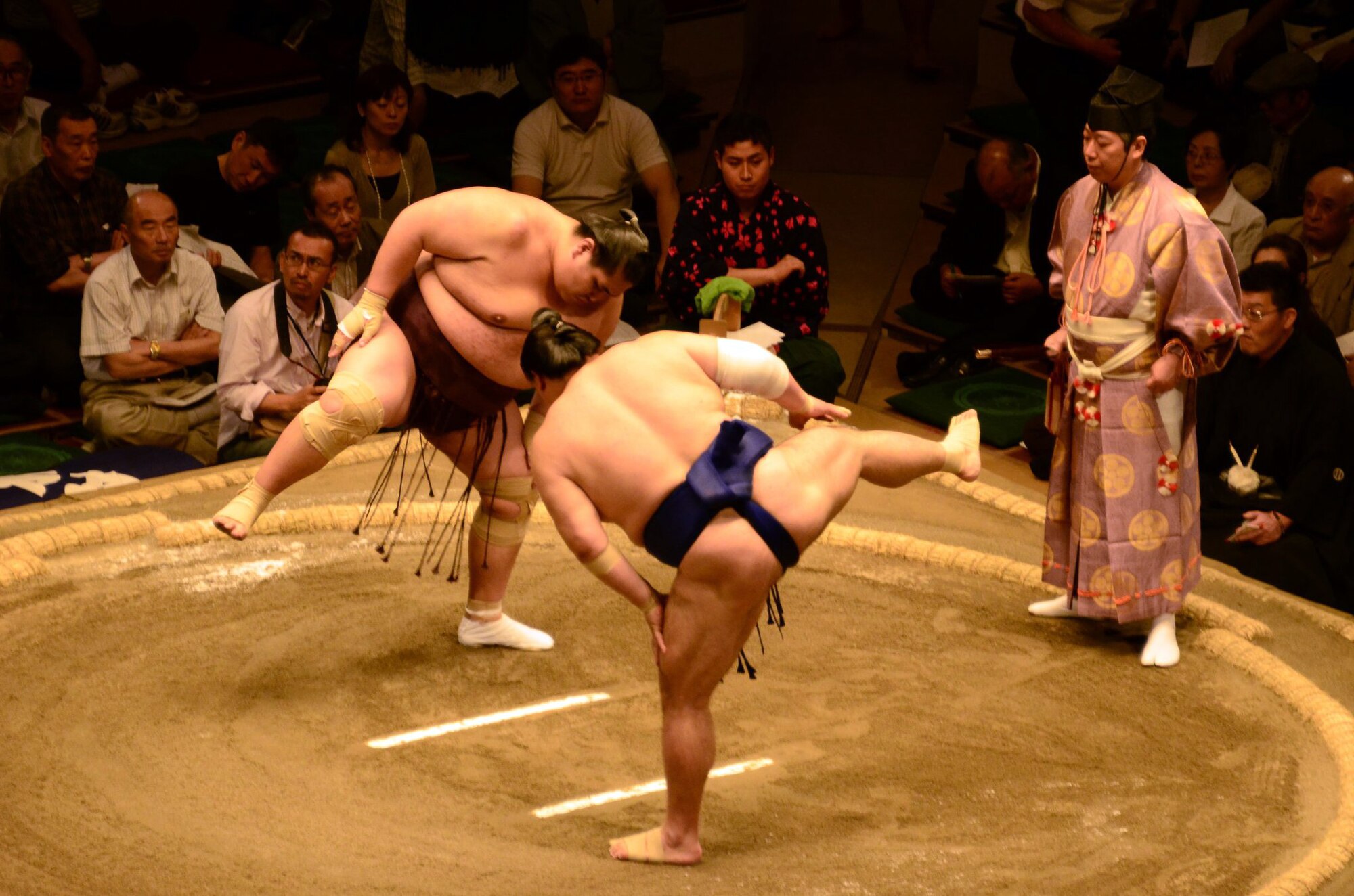 YOKOTA AIR BASE, Japan – Two Sumo wrestlers perform one of the many ceremonial stretches before the wrestlers begin a match at the Ryogoku Kokugikan, Tokyo, Japan, May 14, 2011. More than 150 members of the Yokota family were invited to witness Japan’s national sport first hand. (Courtesy Photo)