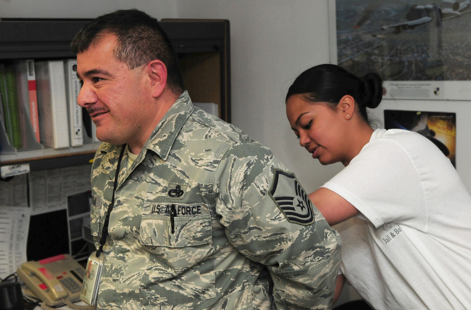 SPANGDAHLEM AIR BASE, Germany – Airman Basic Cheryl Manibusan, 52nd Security Forces Squadron entry controller apprentice, “arrests” Master Sgt. Jose Sandoval, 52nd Aircraft Maintenance Squadron NCO in charge of the support section, during the 52nd Security Forces Squadron’s Jail n’ Bail fundraising event for National Police Week here May 16. Airmen could pay to have their coworkers “arrested,” and brought to the 52nd SFS building to be detained. The money raised from this event will go to the Security Forces Museum at Lackland Air Force Base, Texas. (U.S. Air Force photo/Airman 1st Class Matthew B. Fredericks)