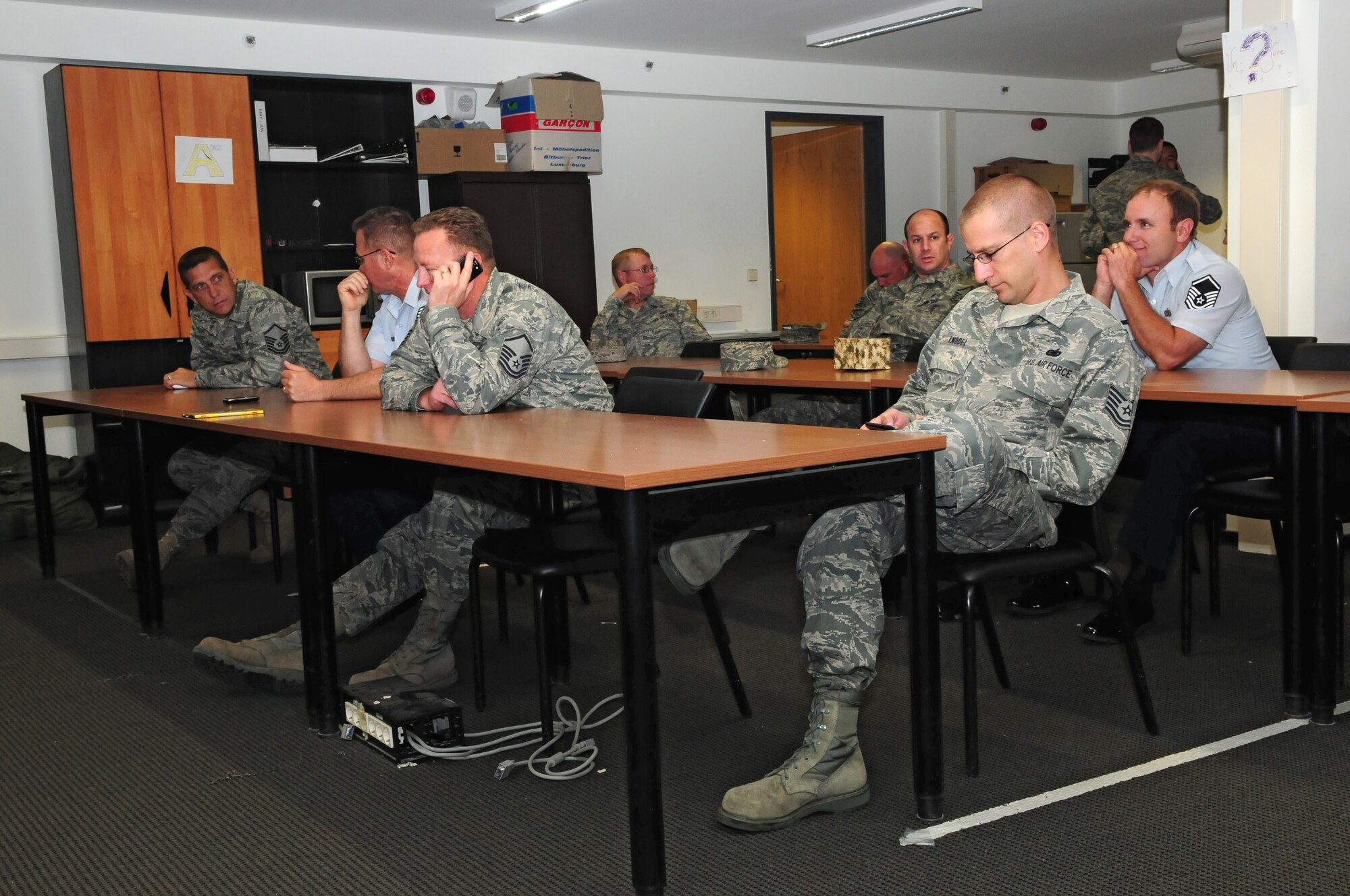 SPANGDAHLEM AIR BASE, Germany – Airmen from the 52nd Fighter Wing sit and wait to be released after being “arrested” during the 52nd Security Forces Squadron’s Jail n’ Bail fundraising event for National Police Week here May 16. Airmen could pay to have their coworkers “arrested,” and brought to the 52nd SFS building to be detained. The money raised from this event will go to the Security Forces Museum at Lackland Air Force Base, Texas. (U.S. Air Force photo/Airman 1st Class Matthew B. Fredericks)