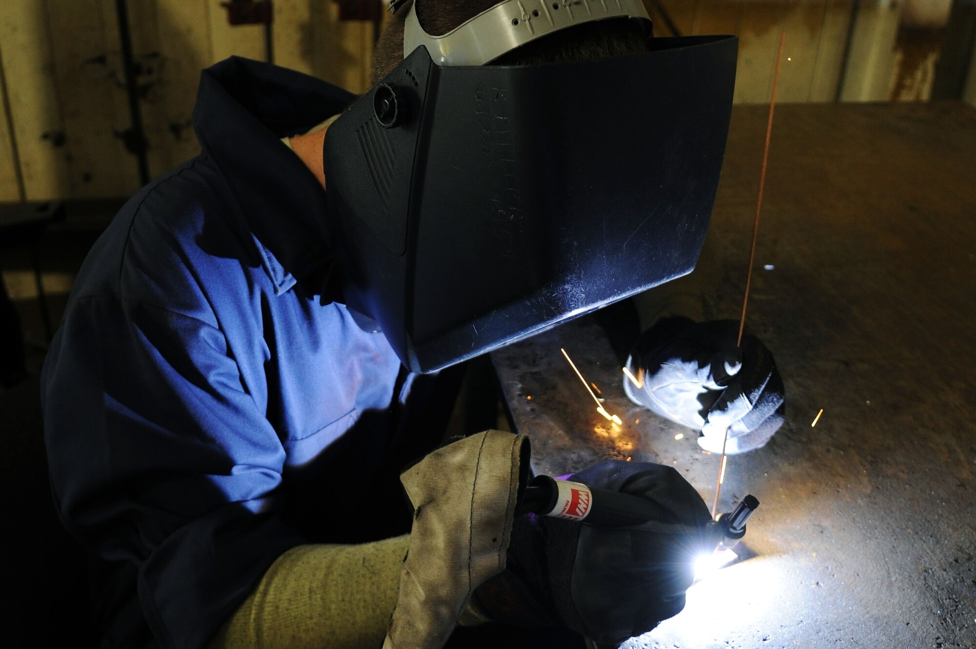 KUNSAN AIR BASE, Republic of Korea -- Senior Airman Kristopher Miller, 8th Aircraft Maintenance Squadron aircraft metal technician, welds a piece of 3130 mob steel here May 19. The 8th Maintenance Group provides munitions, aircraft maintenance and maintenance operations support. (U.S. Air Force photo/Senior Airman Brittany Y. Bateman)