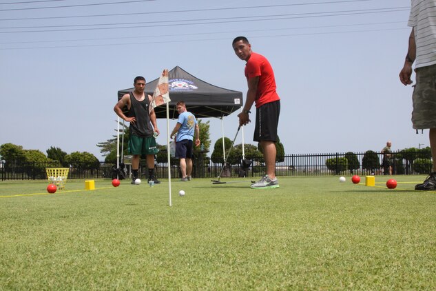 Israel Martinez, Beast Mode team member, putts a golf ball into a hole at the Torii Pines Golf Course station here during the 2011 Amazing Race May 20. All four team members had to make a golf ball in the station’s hole from four different distances before moving onto the next station and within 40 attempts to receive the time bonus.