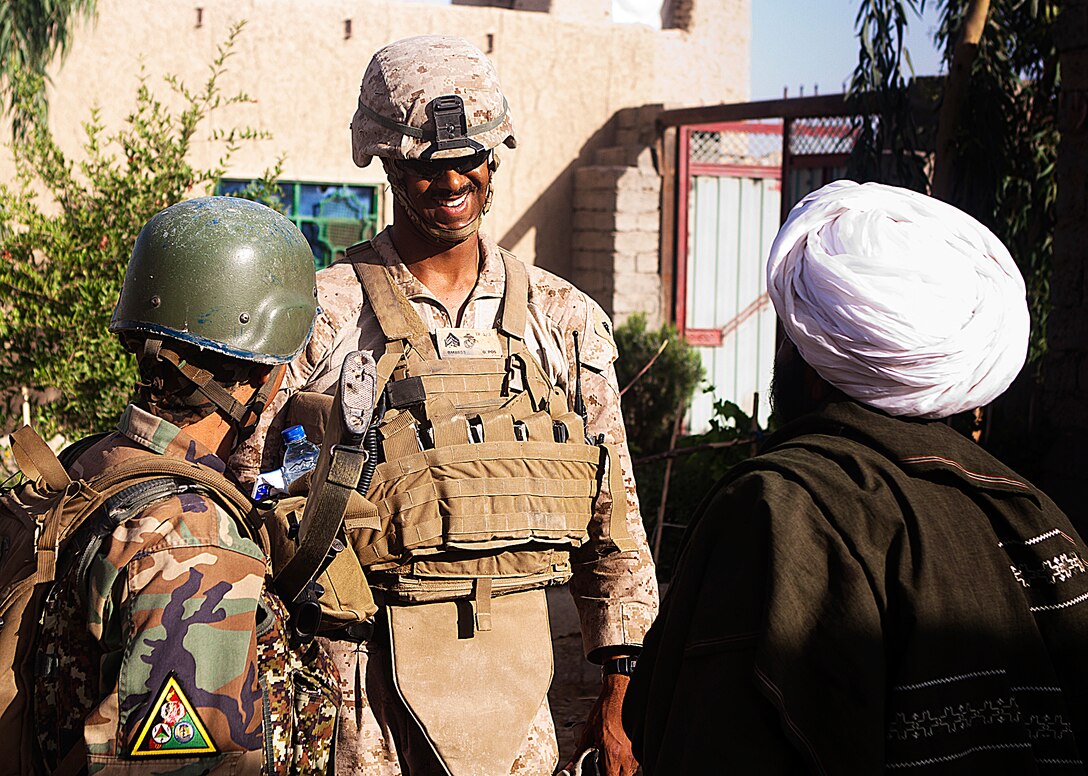 Sgt. Benjamin Maldonado and Sgt. Farhad speak to a local elder during a security patrol here, May 19. Maldonado, a native of Quinton, N.J., is a squad leader with 1st Battalion, 3rd Marine Regiment and Farhad is a squad leader with 2-1-215. They have built a special relationship in only a month’s time. Their relationship is just one example of how Marines from 1/3 are working together with their Afghanistan National Army counterparts. The battalion supports Regimental Combat Team 1 under 2nd Marine Division (Forward), which serves as the ground combat element in Helmand. The mission of the division is to partner with Afghan National Security Forces to conduct counterinsurgency operations to secure the Afghan people, defeat insurgent forces, and enable Afghanistan to assume security responsibilities in the region. Ultimately, the partnered forces promote the expansion of stability, development and legitimate governance.