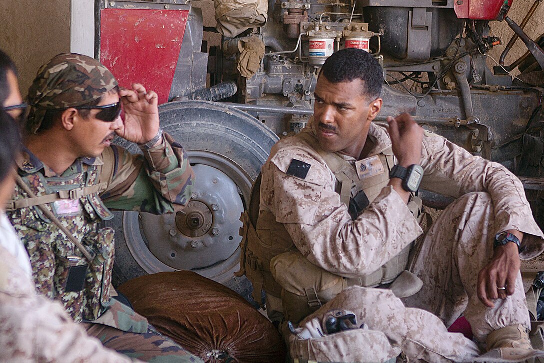 Sgt. Benjamin Maldonado and Sgt. Farhad share a glance while drinking chai tea at a local shop owner’s house during a security patrol here, May 19. Maldonado, a native of Quinton, N.J., is a squad leader with 1st Battalion, 3rd Marine Regiment and Farhad is a squad leader with 2-1-215. He and Farhad have built a special relationship in only a month’s time. Their relationship is just one example of how Marines from 1/3 are working together with Afghanistan National Army counterparts. The battalion supports Regimental Combat Team 1 under 2nd Marine Division (Forward), which serves as the ground combat element in Helmand. The mission of the division is to partner with Afghan National Security Forces to conduct counterinsurgency operations to secure the Afghan people, defeat insurgent forces, and enable ANSF to assume security responsibilities in the region. Ultimately, the partnered forces promote the expansion of stability, development and legitimate governance.