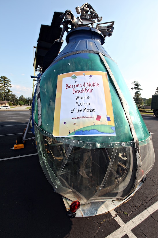 JACKSONVILLE, N.C.—A sign on a Navy helicopter advertises the Museum of the Marine’s book fair and living history display at Barnes and Noble May 20 through 22.  The event, which was a fundraiser, showcased some of the artifacts that may be in the museum once it is completed.  The museum’s goal is to break ground this spring.