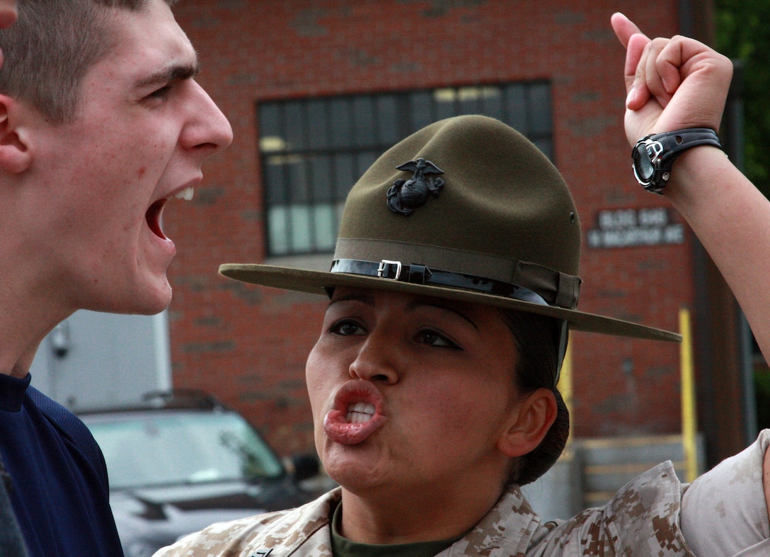 Drill Instructor Staff Sgt. Laura Carrillo provides some motivation to a poolee during Recruiting Station Portsmouth's annual field meet. Nearly 500 poolees attnded the field meet and took part in various training exercises May 20 and 21.