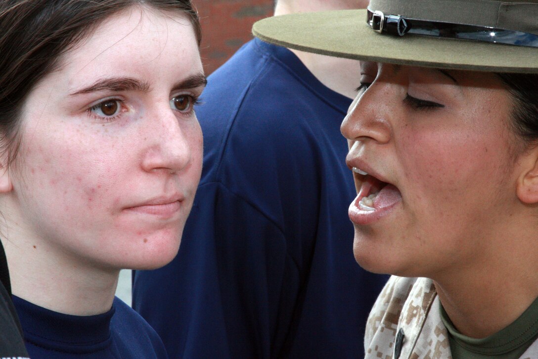 Drill Instructor Staff Sgt. Laura Carrillo motivates a poolee during Recruiting Station Portsmouth's annual field meet May 20. Nearly 500 poolees attended the event and slept in tents overnight to resume training the following day.