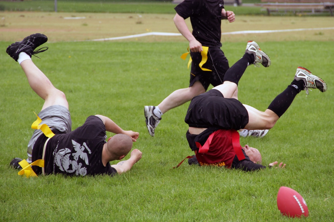 Sgt. Jonathan B. Ebsen, Recruiting Substation Sioux Falls, collides with Master Sgt. Timothy W. Allen, Recruiting Substation Fargo, during the Recruiting Station Twin Cities Flag Football Tournament May 20. Ebsen, 26, is from Milbank, S.D. For additional imagery from the event, visit www.facebook.com/rstwincities.