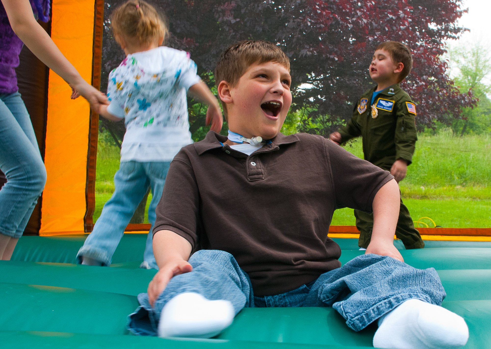 JOINT BASE ANDREWS, Md. – Isaiah Horst, Pilot for a Day alum, plays in a moon bounce at the Pilot for a Day reunion here on May 20. The 201st Airlift Wing, The 113th Wing and The 459th Air Refueling Wing sponsored the Pilot for a Day 2011 reunion during the Joint Service Open House. The Pilot for a Day program offers kids with serious illnesses a special day to be an Air Force pilot, giving them a break from whatever challenges they may face. (U.S. Air Force photo/ Staff Sgt. Sophia Piellusch)