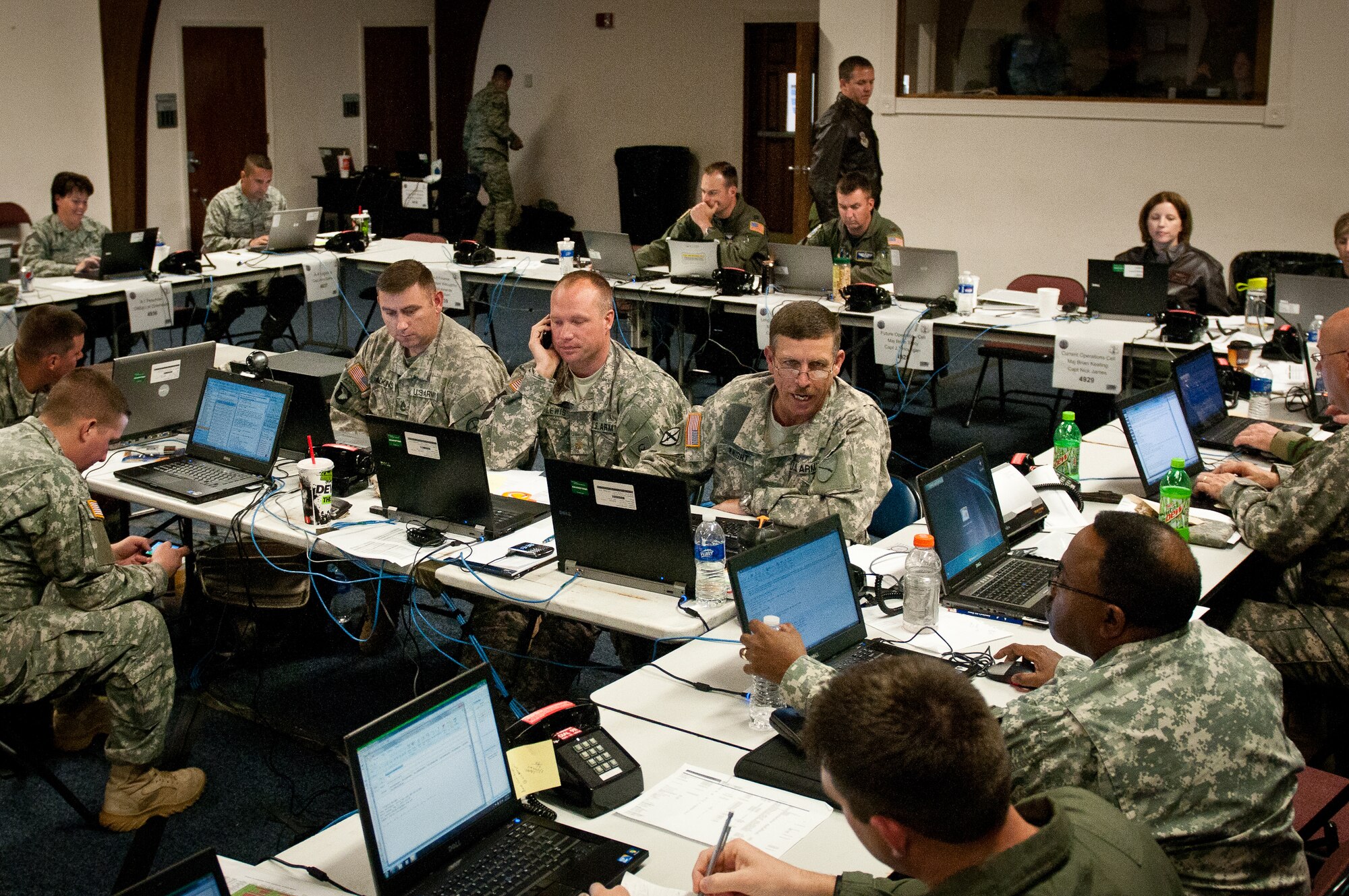 Airmen and Soldiers from the Kentucky National Guard work in a Joint Air Operations Center at the Kentucky Air National Guard Base in Louisville, Ky., May 17, 2011. The JAOC staff is supporting a major earthquake-response exercise by prioritizing and allocating air assets for missions into affected areas across the state. (U.S. Air Force photo/Capt. John T. Stamm)
