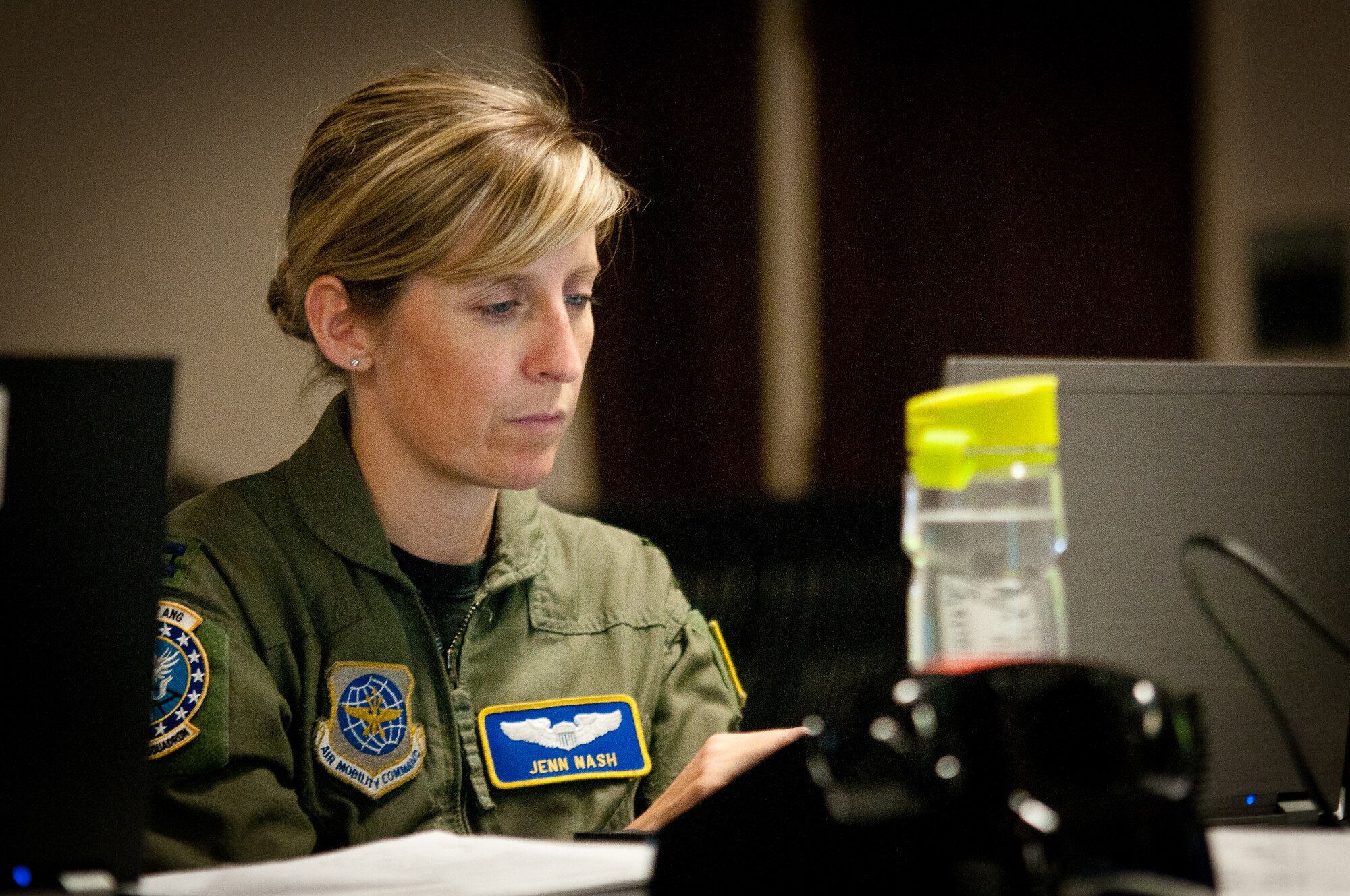 Capt. Jenn Nash coordinates long-range mission planning for the Joint Air Operations Center at the Kentucky Air National Guard Base in Louisville, Ky., May 17, 2011. The JAOC is supporting a major earthquake-response exercise by prioritizing and allocating air assets for missions into affected areas across the state. (U.S. Air Force photo/Capt. John T. Stamm)