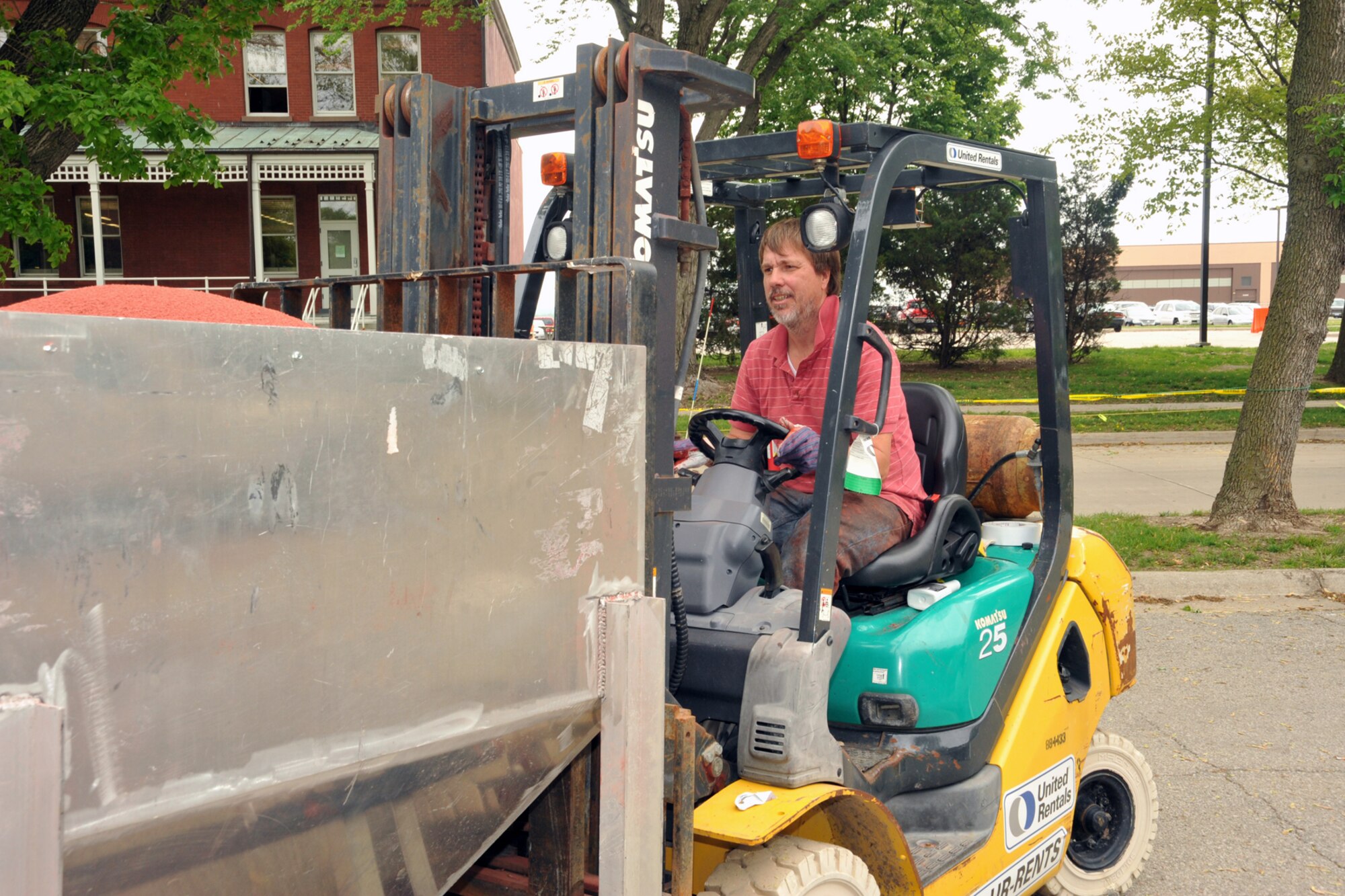 OFFUTT AIR FORCE BASE, Neb. -- Mark Hogan of Bynon Sports, parks a truck load of rubber particles in the parking lot adjacent to the parade field at Offutt Air Force Base on May 18.  The rubber surface is being installed on the running track that surrounds the field.  Bynon Sports, which is located in Hunt Valley, Maryland was contracted to cover the concrete track at the Offutt parade field with a rubber surface. U.S. Air Force Photo by D.P. Heard
