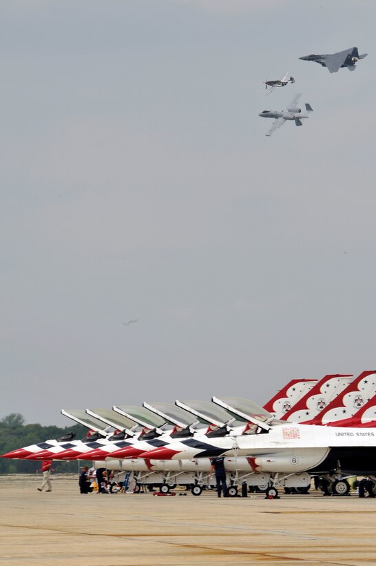 USAF Heritage Flight performs for the crowd during the Joint Service Open House May, 20 at Joint Base Andrews, Md. JSOH affords the public an opportunity to meet the men and women of the Armed Forces and to see military equipment through the efforts of active duty guard and reserve service members, as well as civilians employees, retirees and family members. (U.S. Air Force photo by Senior Airman Perry Aston) 