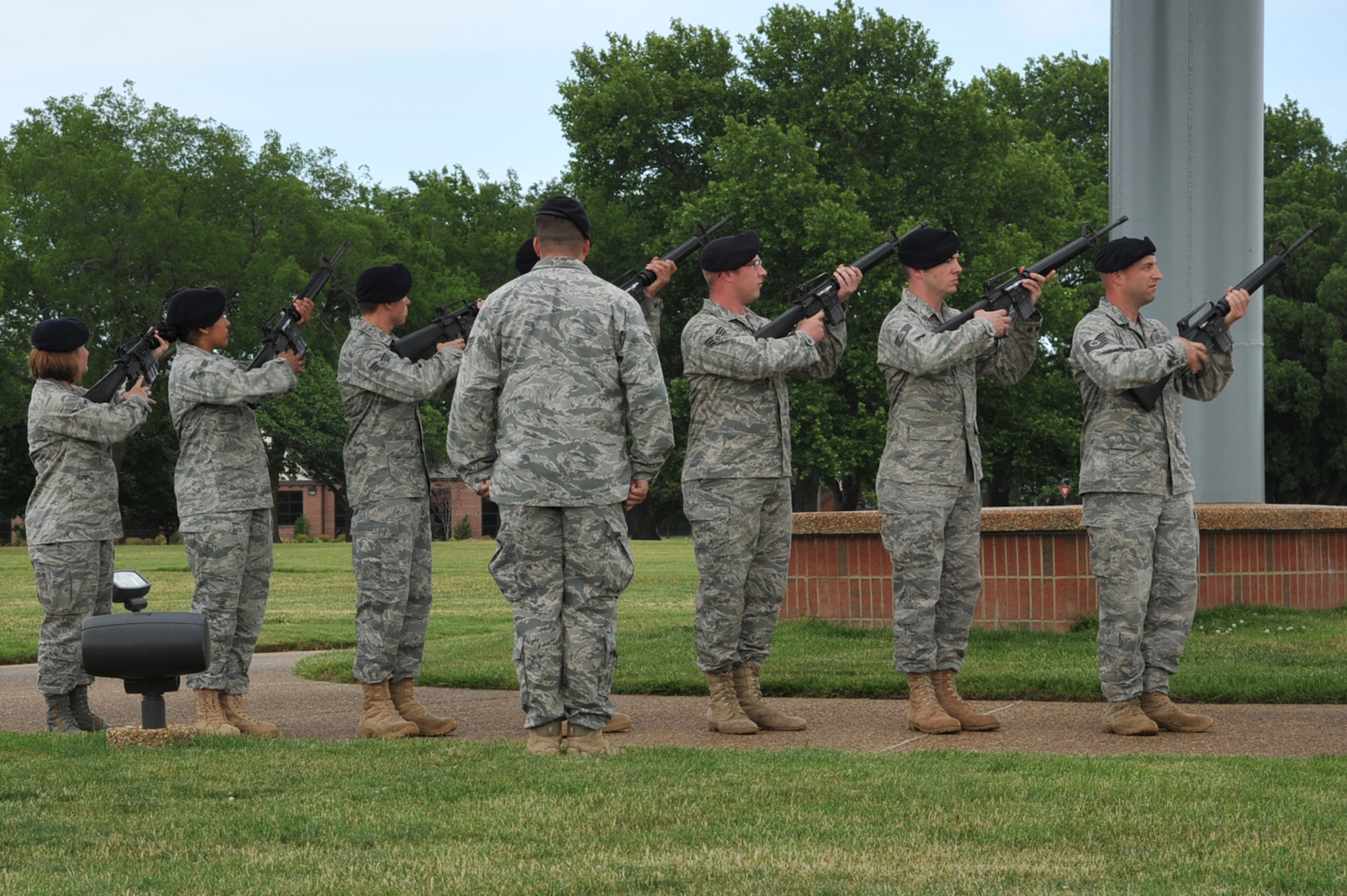 633d Security Forces Airmen preform a 21 shoot salute for  Argo, 633d SFS Military Working Dog, during his retirement during National Police Week at Langley Air Force Base, Va., May 20, 2011. The National Police Week occurs each year and pays special recognition to those law enforcement officers, civilian and military, who have lost their lives in the line of duty. (U.S. Air Force photo by Airman 1st Class Camilla Griffin)(RELEASED)