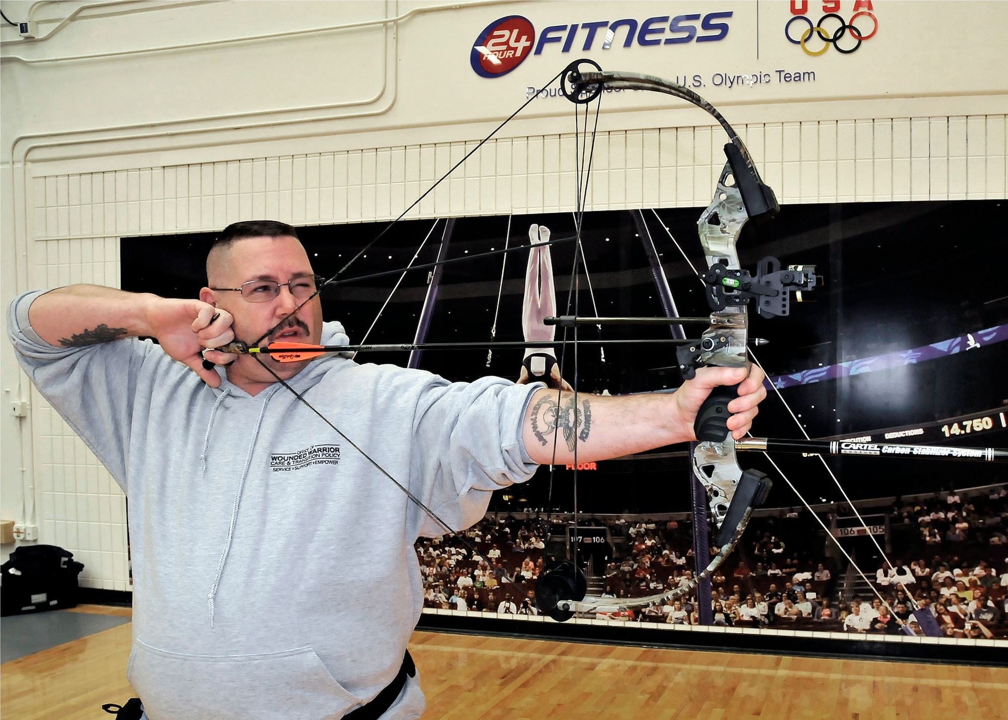 Retired Staff Sgt. Jack Shaw demonstrates proper form in shooting a compound bow during archery practice May 15, 2011, at the 2011 Warrior Games at the U.S. Olympic Training Center at Colorado Springs, Colo.  (U.S. Air Force photo/Lt. Col. Richard Williamson)