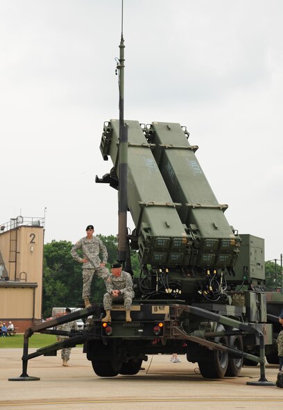 Army Specialist Anthony L. McKee, launcher crew member and Army Staff Sgt. Richard A. Blair, launcher section chief from Bravo 1/7, 108th Air Defense Artillary Brigade, Fort Bragg, NC, with their PAC III Patriot Launching Station at the 2011 Joint Service Open House.  JSOH affords members of the public an excellent opportunity to meet and interact with the men and women of the Armed Forces and to showcase military equipment from the Navy, Marines, Army, Air Force, and Coast Guard.  JSOH is planned and conducted by Total Force; Active, Guard, Reserve, Civilian employees, as well as retirees and family. (U.S. Marine Corps photo)